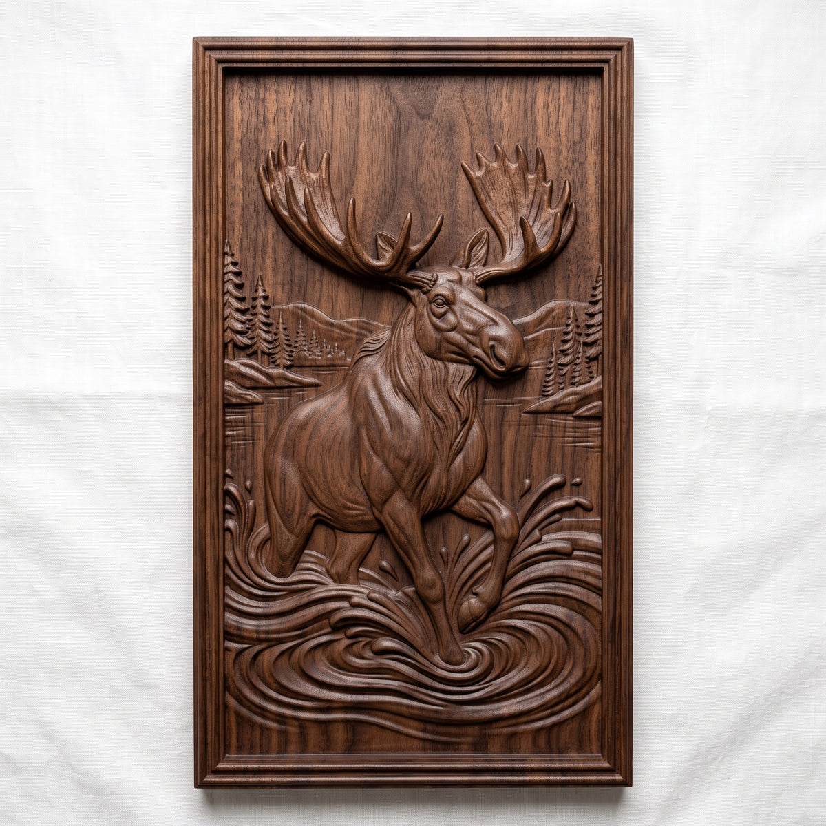 Realistic moose with huge palmate antlers wading and splashing through a lake with pine trees and distant hills behind, shown as a tall portrait rectangular frame relief plaque with a stepped molded border, digital STL model for CNC router carving and 3D printing.