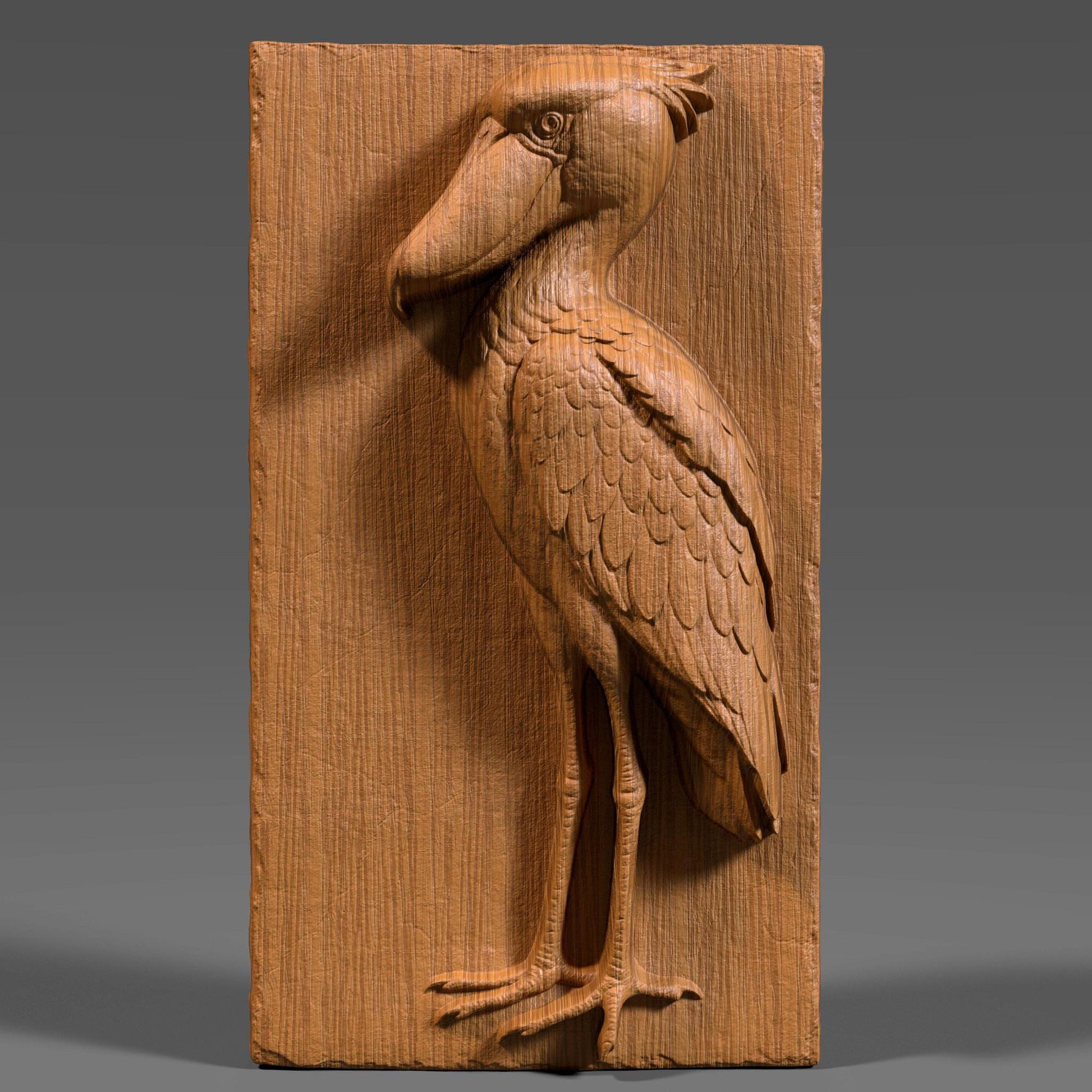 3D bas-relief carving of a majestic shoebill stork etched into a vertical wood panel, showcasing intricate feather details and a proud pose with its oversized beak and long legs. The digital sculpture highlights natural wood grain with depth and realism, suitable for CNC routing or laser engraving. Ideal for wildlife wall art, nature decor, or ornamental wood panels, this design captures the exotic elegance of the shoebill bird in a timeless, carved wooden form.