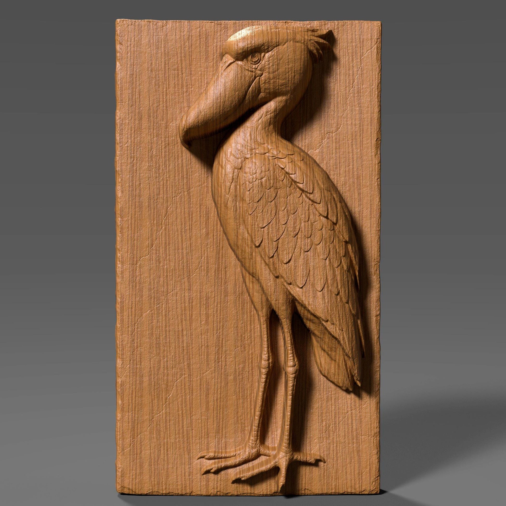 3D bas-relief carving of a majestic shoebill stork etched into a vertical wood panel, showcasing intricate feather details and a proud pose with its oversized beak and long legs. The digital sculpture highlights natural wood grain with depth and realism, suitable for CNC routing or laser engraving. Ideal for wildlife wall art, nature decor, or ornamental wood panels, this design captures the exotic elegance of the shoebill bird in a timeless, carved wooden form.