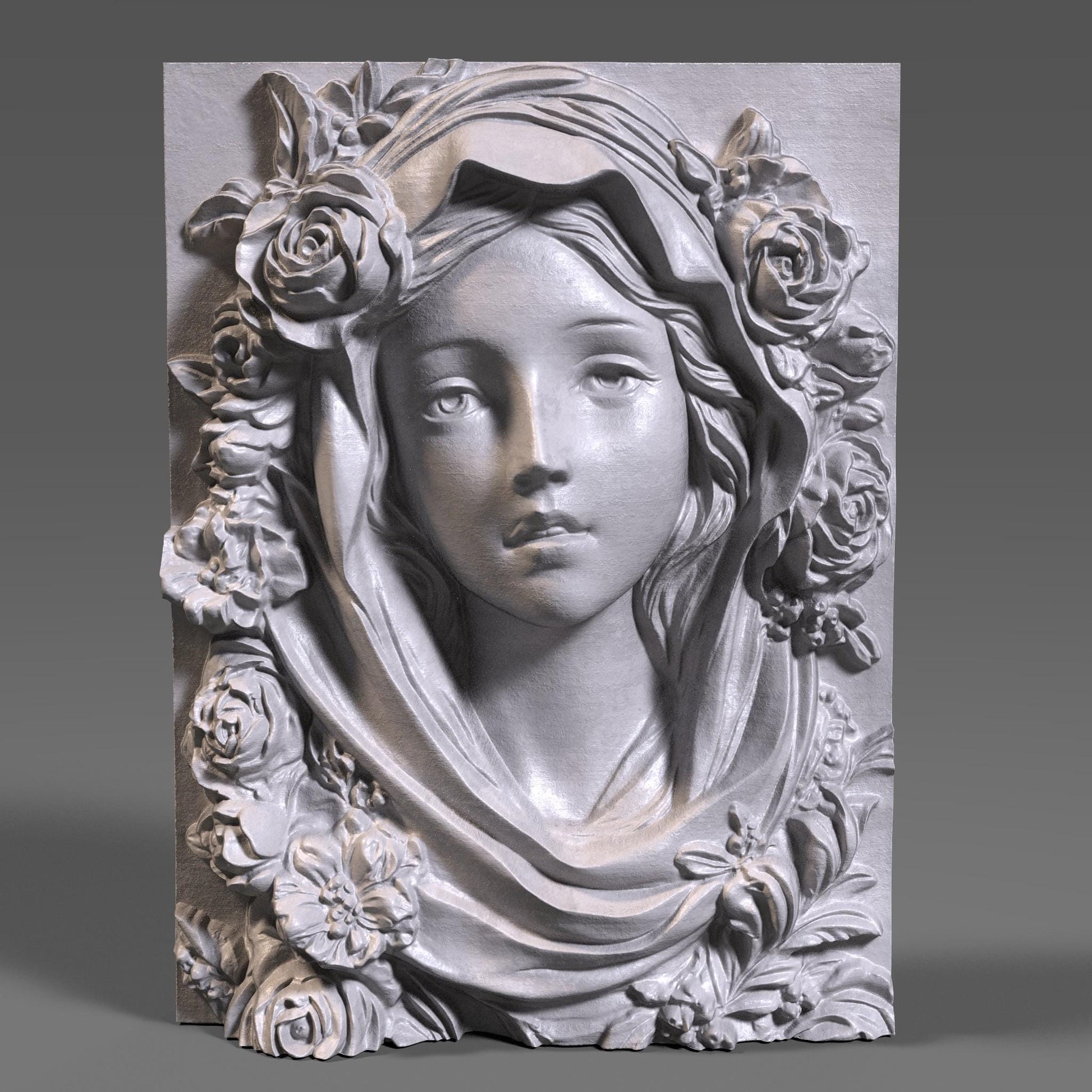 Highly detailed 3D STL model of Mother Mary’s face with a calm, spiritual expression, surrounded by carved roses and draped fabric. Designed in wood bas-relief style for CNC, laser engraving, or 3D printing. Ideal for religious wall décor or Catholic sacred art. The model features traditional iconography of the Virgin Mary with floral symbolism, ready for carving in wood, resin, or stone. STL file requires cleanup depending on machine compatibility.