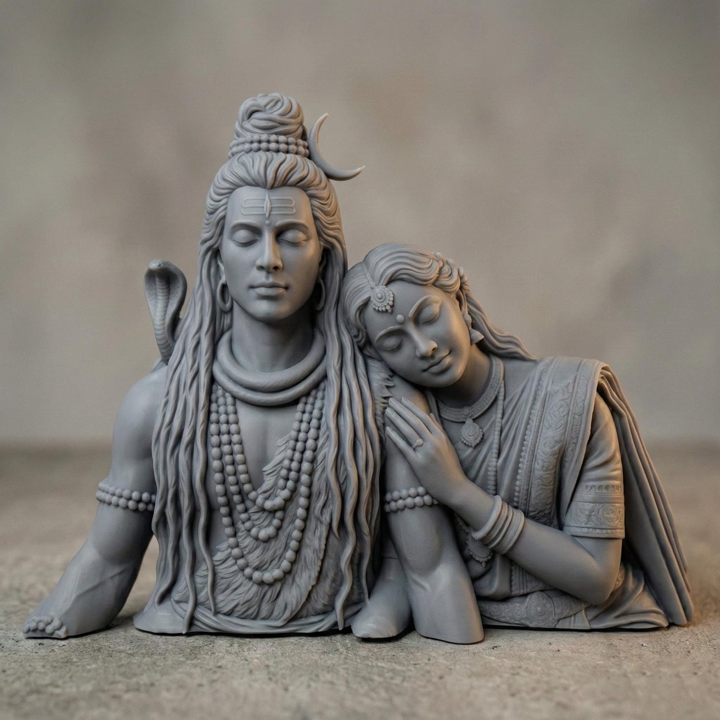 Detailed 3D STL model of Lord Shiva and Goddess Parvati depicted as a serene divine couple, sculpted in a realistic wooden carving style. Parvati rests gently on Shiva’s shoulder, symbolizing love, balance, and devotion. The model features intricate hair, jewelry, facial expressions, and traditional Indian ornaments, designed for CNC wood carving, 3D printing, and religious wall or tabletop decor. Digital STL download for personal or commercial fabrication.