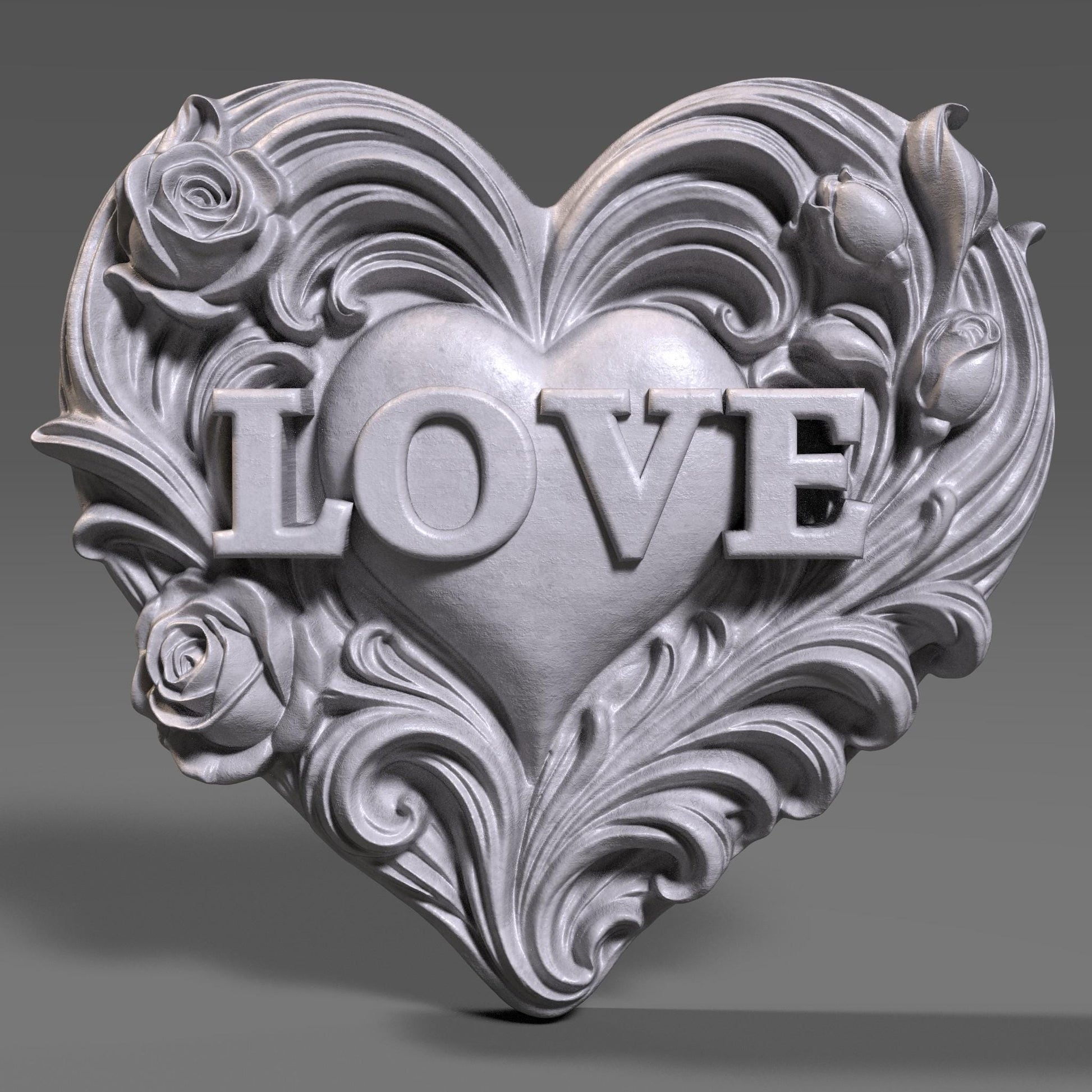 Romantic heart-shaped bas relief sculpture featuring the word LOVE carved in raised letters, surrounded by flowing floral and scroll details. Shown in warm carved wood and modern gray resin finishes, displayed as elegant tabletop and wall decor. Ideal for Valentine’s Day, anniversaries, weddings, or romantic home decor with a handcrafted, sculptural aesthetic.