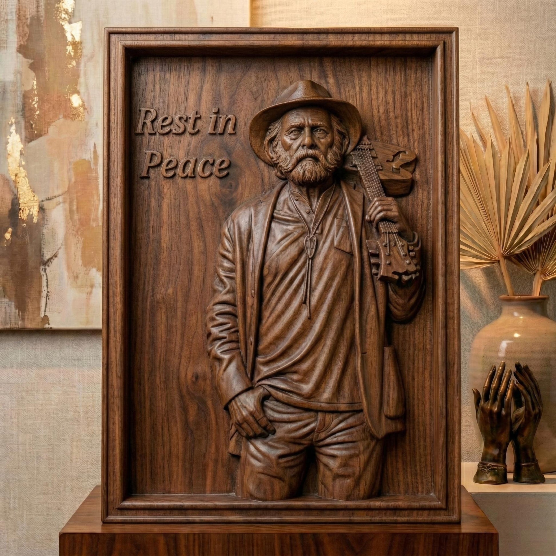 Detailed 3D relief sculpture of an elderly bearded musician wearing a hat and jacket, holding an acoustic guitar over his shoulder. The figure is carved in a realistic wood-grain style with expressive facial features and deep folds in clothing. A framed bas-relief version includes the engraved text “Rest in Peace,” creating a solemn memorial tribute suited for CNC carving, 3D printing, and wall art display.