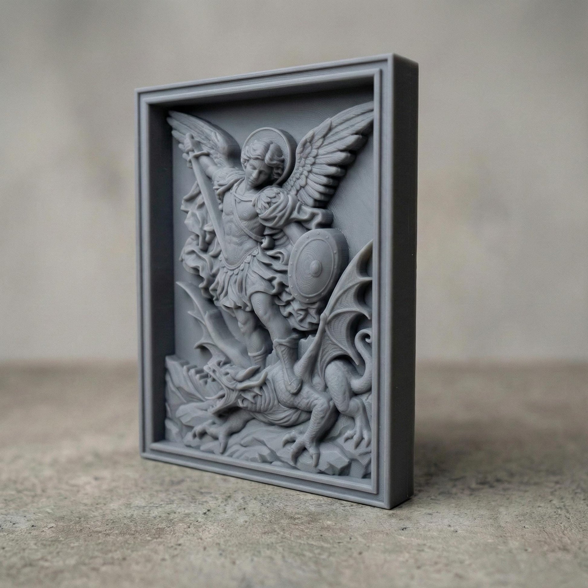 Wooden bas-relief wall art depicting Archangel Michael in dynamic motion, carved in deep relief. The winged angel holds a raised sword and shield while standing triumphantly over a defeated dragon beneath his feet. Flowing robes, detailed feathers, and dramatic cloud forms surround the figure. Rendered in rich carved wood texture with smooth depth transitions, suitable for CNC carving, wood engraving, and religious Christian wall décor.