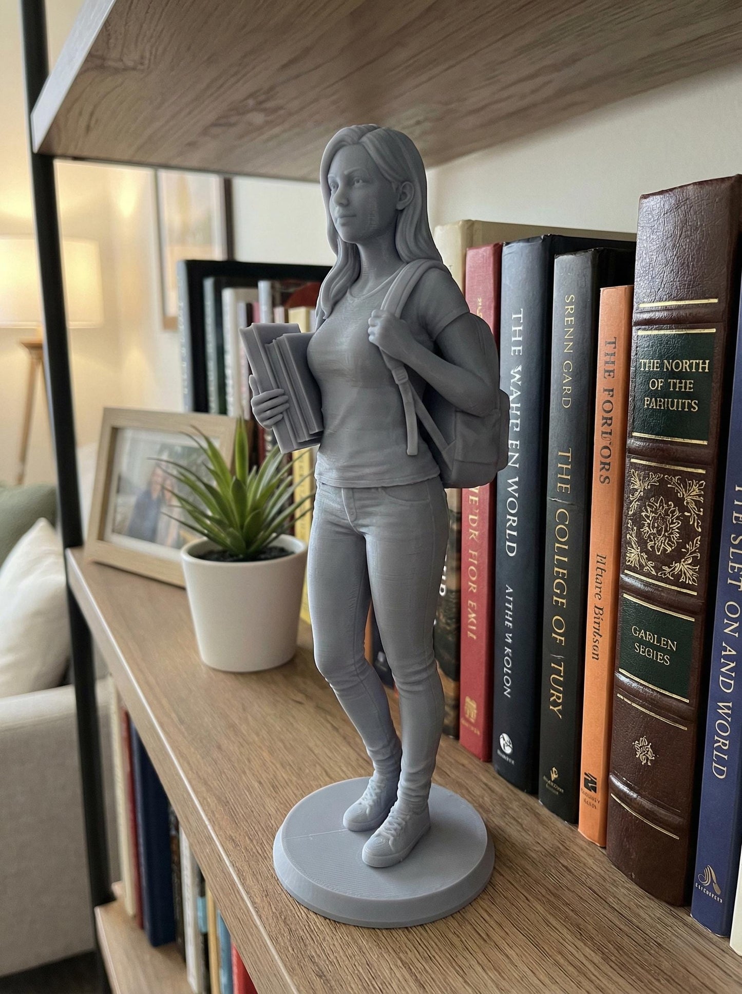 High-detail resin 3D printed human figure sculpture, digitally sculpted with realistic anatomy, facial structure, and tailored clothing. The statue stands on a round base with smooth surface finish, showcasing professional character modeling, accurate proportions, and refined details inspired by cinematic and game-quality digital sculpting, suitable for display, custom portraits, memorials, and collectible art