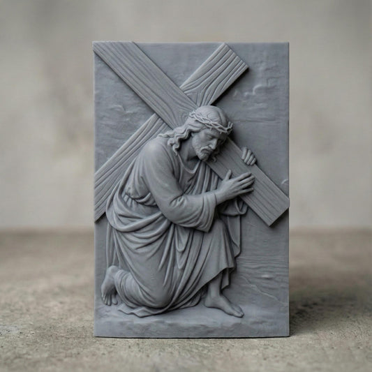 A deep relief 3D sculpture of Jesus Christ kneeling and carrying the cross, rendered in high-resolution gray resin with stone-like finish. The artwork features expressive facial details, flowing robes, and realistic wood grain texture on the cross. Ideal for Christian home decor, religious gifts, or prayer room installations. Studio lighting highlights the elegant depth and intricate craftsmanship of the resin print.