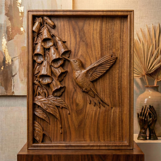Elegant hummingbird bas relief STL depicting a hummingbird in flight feeding from cascading bell-shaped flowers, carved within a refined rectangular frame. The design features flowing leaves, delicate floral textures, and detailed feathers set against a smooth wood-grain background. Ideal for CNC wood carving, 3D printing, or framed wall art panels inspired by botanical and wildlife themes.