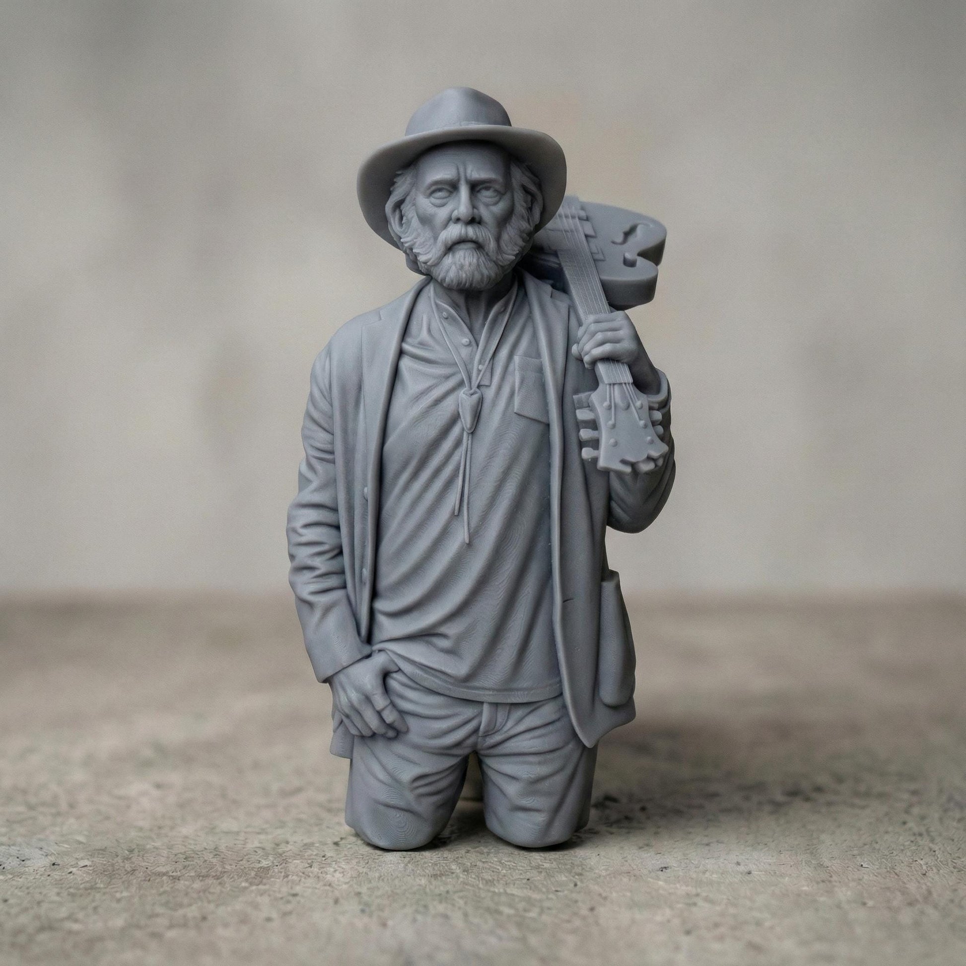 Detailed 3D relief sculpture of an elderly bearded musician wearing a hat and jacket, holding an acoustic guitar over his shoulder. The figure is carved in a realistic wood-grain style with expressive facial features and deep folds in clothing. A framed bas-relief version includes the engraved text “Rest in Peace,” creating a solemn memorial tribute suited for CNC carving, 3D printing, and wall art display.