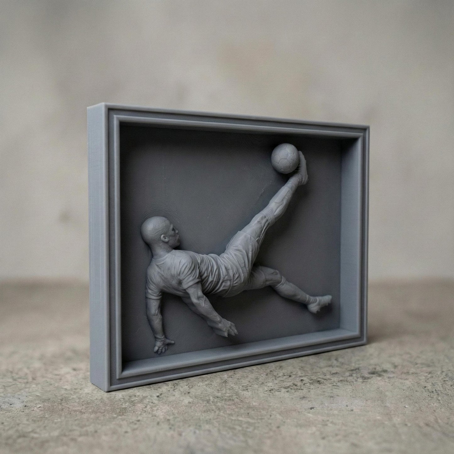 Highly detailed 3D bas-relief of a soccer player performing an overhead bicycle kick, carved in a realistic wood style. The athletic figure is captured mid-air with extended leg striking a football, showcasing dynamic motion, muscle definition, and flowing sportswear. Ideal for CNC carving, 3D printing, and wall-mounted sports decor, symbolizing passion, strength, and competitive spirit in football-inspired art.