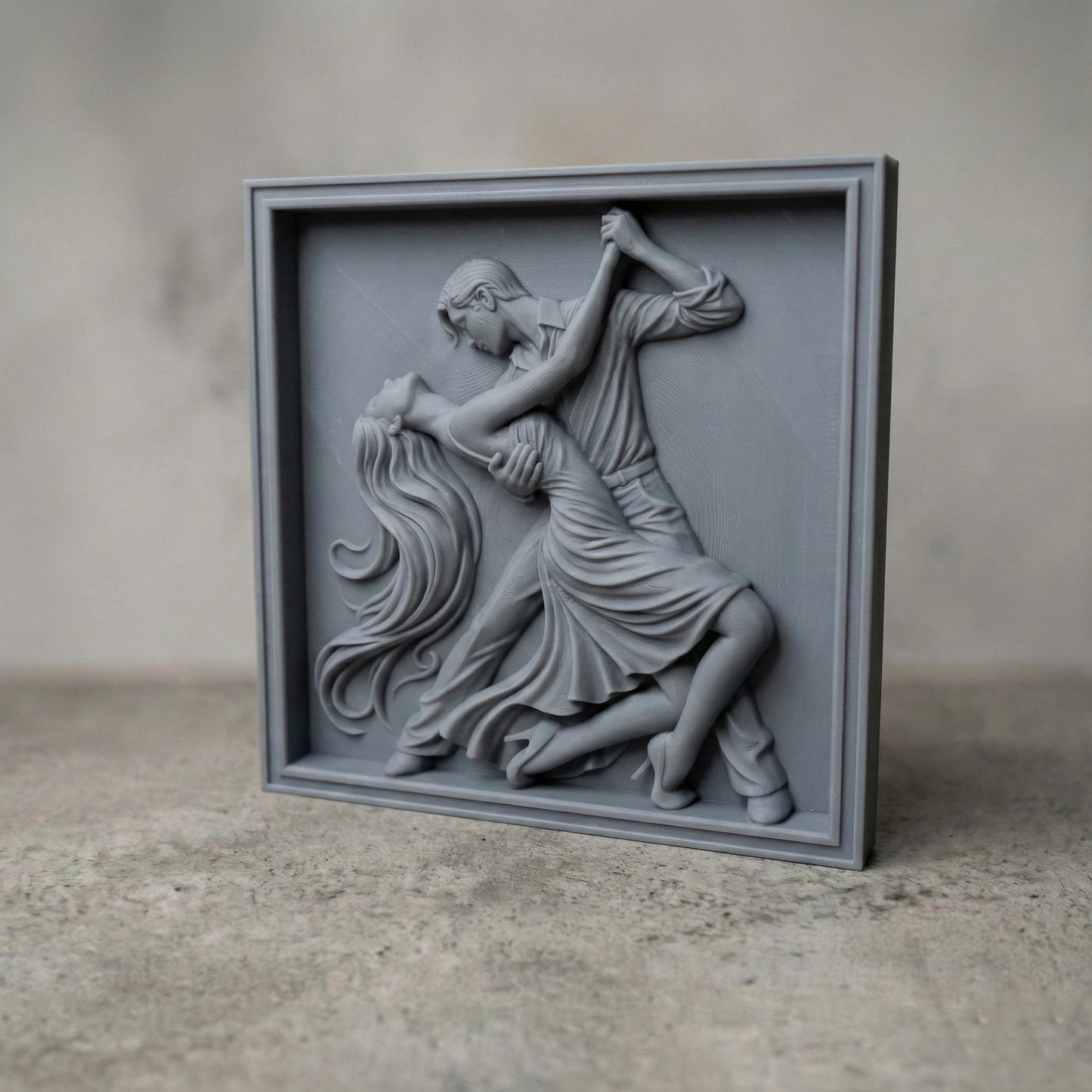Elegant tango dance couple bas-relief depicting a passionate ballroom pose with flowing dress, intertwined movement, and expressive body language. Detailed sculpted relief designed for CNC carving, 3D printing, or wood engraving, featuring deep contours, smooth curves, and dramatic motion ideal for decorative wall art and artistic relief projects.
