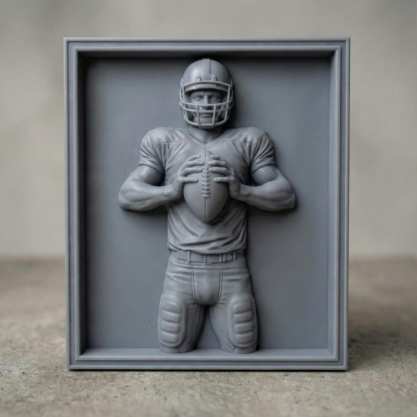 Detailed bas-relief carving of an American football player holding a ball in a ready quarterback stance, wearing a helmet and padded uniform. The design features realistic muscle definition, fabric folds, and sports gear textures carved in a wood-grain style. Ideal for CNC carving, 3D printing, or decorative sports wall art, perfect for football fans, man caves, and athletic-themed interiors.