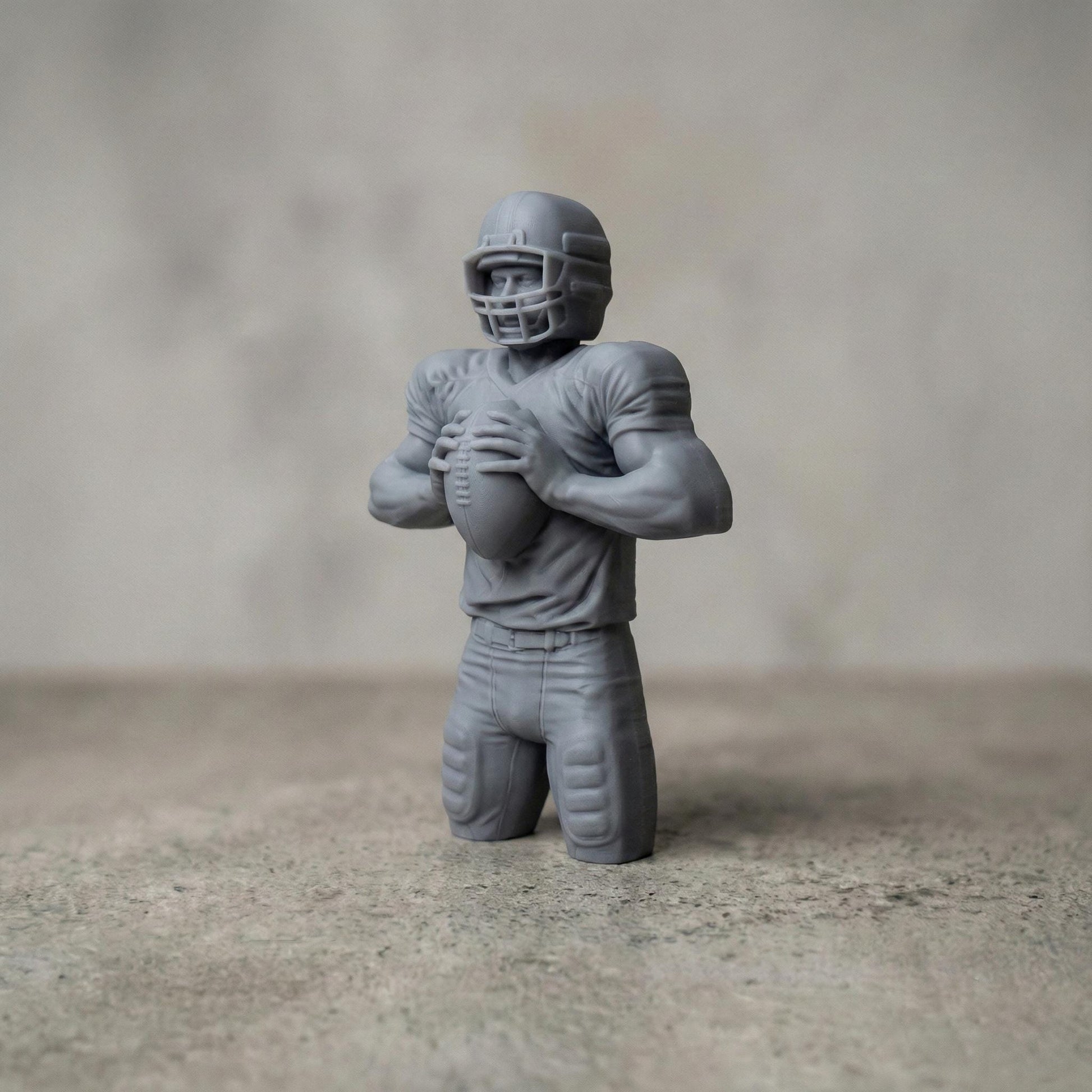 Detailed bas-relief carving of an American football player holding a ball in a ready quarterback stance, wearing a helmet and padded uniform. The design features realistic muscle definition, fabric folds, and sports gear textures carved in a wood-grain style. Ideal for CNC carving, 3D printing, or decorative sports wall art, perfect for football fans, man caves, and athletic-themed interiors.