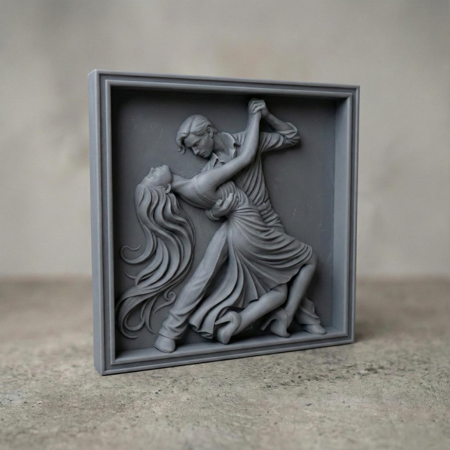 Elegant tango dance couple bas-relief depicting a passionate ballroom pose with flowing dress, intertwined movement, and expressive body language. Detailed sculpted relief designed for CNC carving, 3D printing, or wood engraving, featuring deep contours, smooth curves, and dramatic motion ideal for decorative wall art and artistic relief projects.