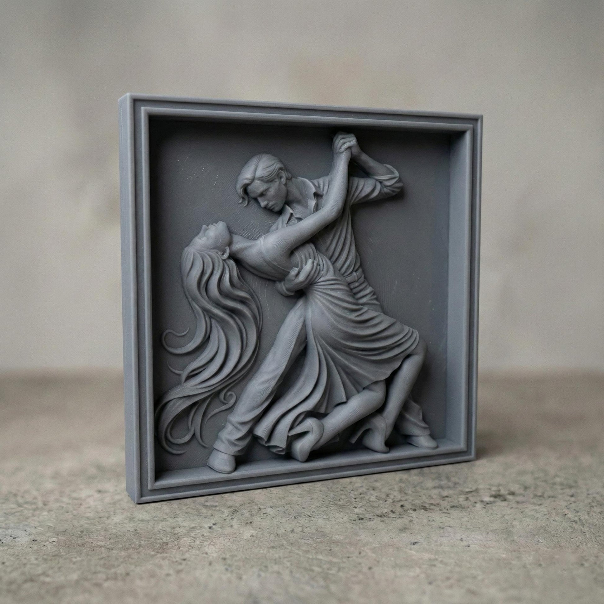 Elegant tango dance couple bas-relief depicting a passionate ballroom pose with flowing dress, intertwined movement, and expressive body language. Detailed sculpted relief designed for CNC carving, 3D printing, or wood engraving, featuring deep contours, smooth curves, and dramatic motion ideal for decorative wall art and artistic relief projects.