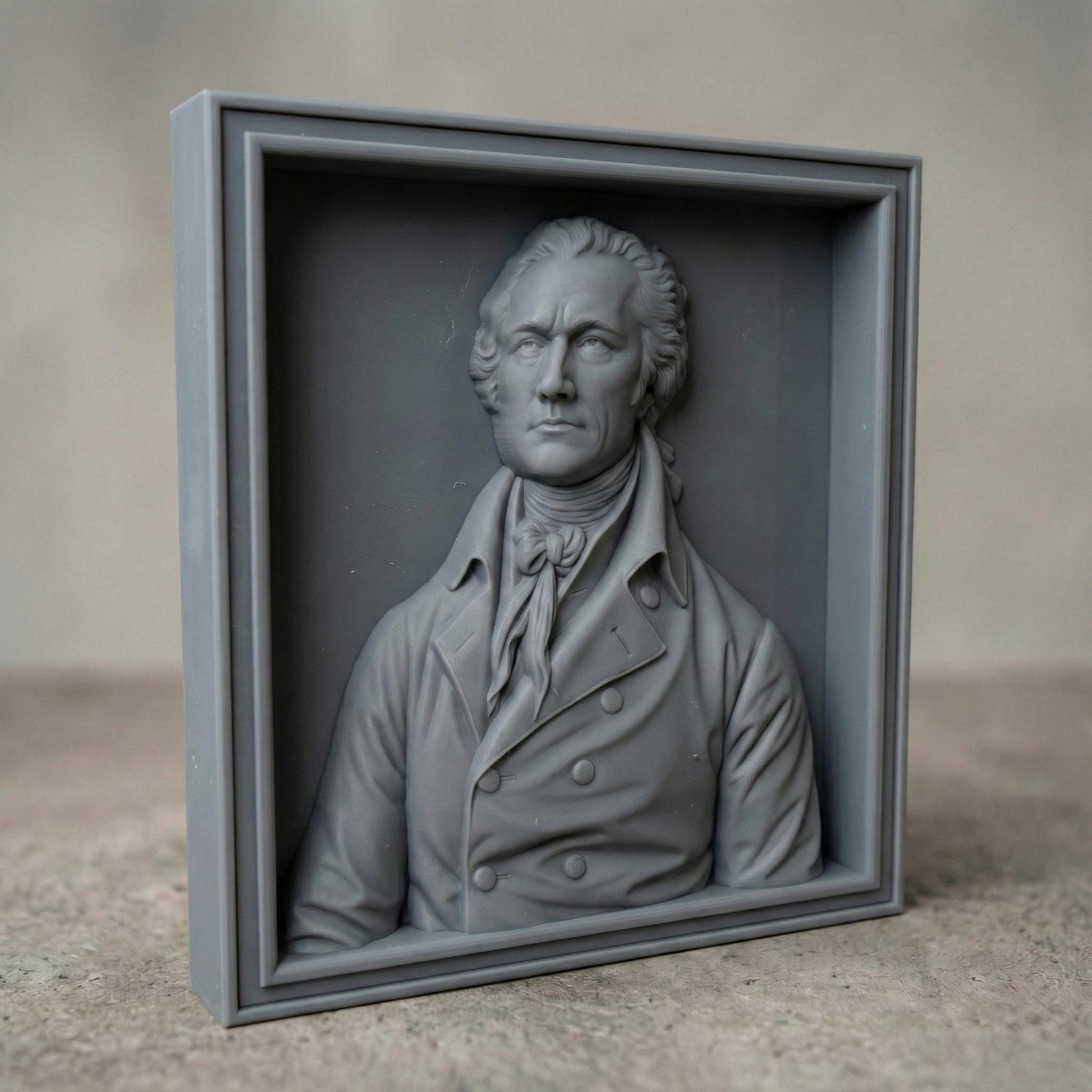 Highly detailed 3D bas-relief portrait of Alexander Hamilton carved in rich wood texture, featuring an 18th-century formal coat with double-breasted buttons and cravat. The bust is framed in a classic wooden border, emphasizing depth, realism, and historical elegance. The sculpture captures a dignified expression and refined facial features, ideal for patriotic home decor, office wall art, or historical display projects.