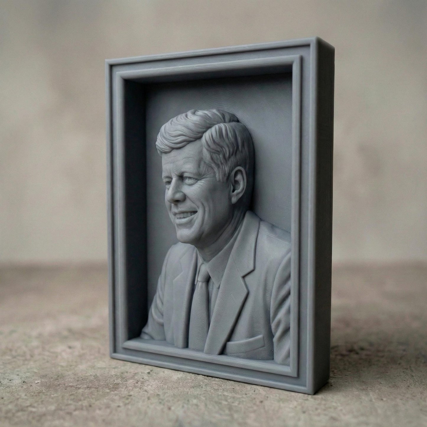 Detailed bas-relief portrait of a smiling mid-century president in a suit and tie, carved in rich wood texture with flowing hair strands, expressive eyes, and realistic facial contours. Displayed as both a freestanding bust on a workbench with carving tools and as a framed wall relief panel, evoking patriotism, leadership, and historic American legacy in a classic handcrafted style.