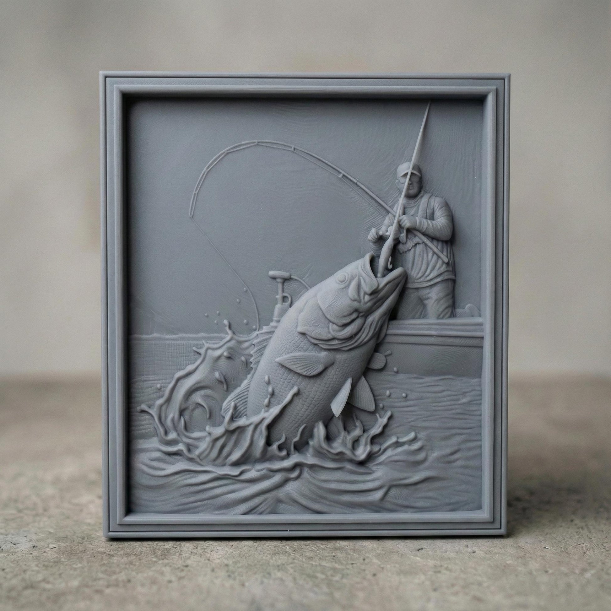 High-detail bas-relief carving of a fisherman standing in a boat, reeling in a massive jumping bass as water splashes dramatically around it. The scene features a bent fishing rod, textured fish scales, rippling waves, and dynamic motion captured in layered depth. Shown as both a rich wood-style carved panel and a smooth gray 3D print relief, framed as a striking rustic fishing lodge wall décor piece.