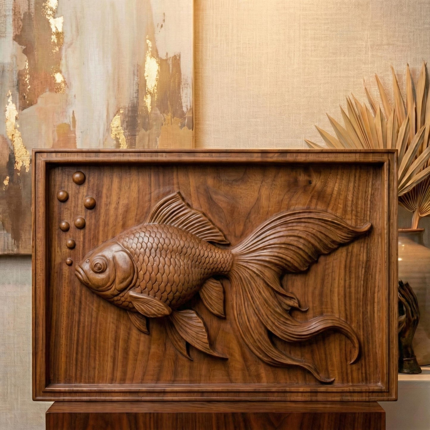 Elegant bas-relief carving of a flowing goldfish with detailed scales, large expressive eye, and long, graceful fins drifting through water bubbles. The design is shown as a framed wooden wall panel, a carved wood plaque on a workbench with chisels, and a standalone 3D sculpted fish model. The composition highlights fluid movement, layered depth, and ornamental aquatic beauty ideal for serene home décor.