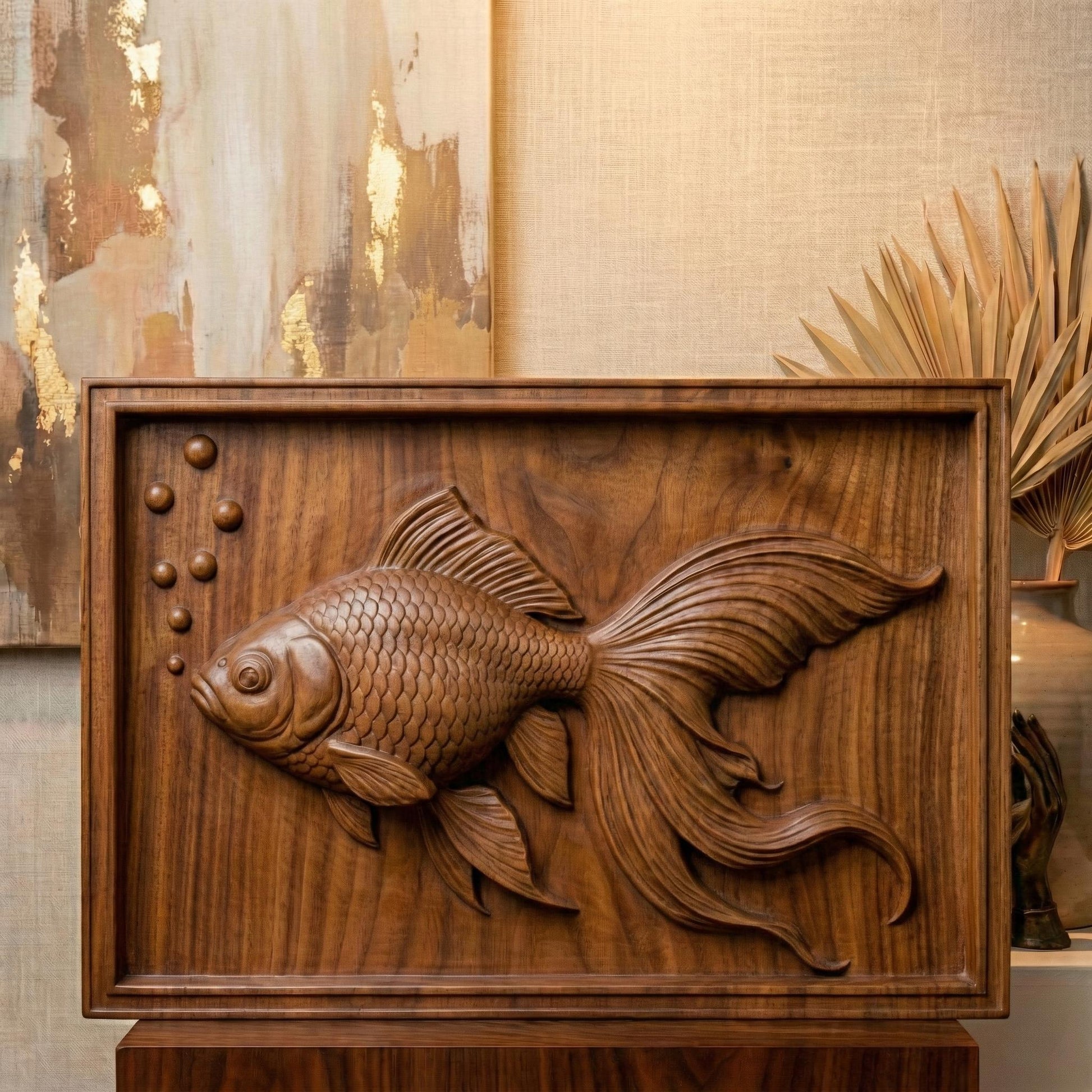 Elegant bas-relief carving of a flowing goldfish with detailed scales, large expressive eye, and long, graceful fins drifting through water bubbles. The design is shown as a framed wooden wall panel, a carved wood plaque on a workbench with chisels, and a standalone 3D sculpted fish model. The composition highlights fluid movement, layered depth, and ornamental aquatic beauty ideal for serene home décor.