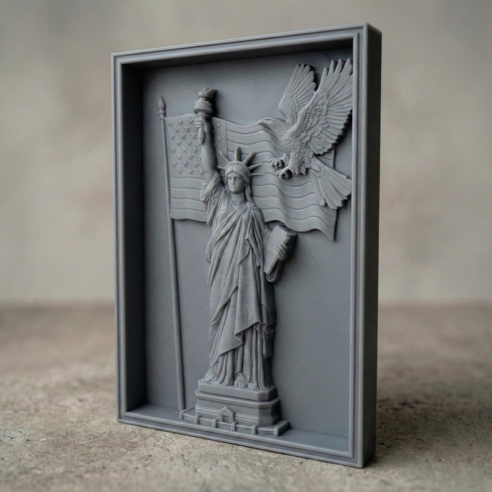 A detailed 3D bas-relief design featuring the Statue of Liberty holding a torch and a book, with a bald eagle soaring across a flowing American flag. This powerful vertical artwork celebrates Independence Day (United States) and is perfect for CNC carving, laser engraving, or 3D printing on wood, resin, or stone. Ideal for July 4th patriotic displays, American-themed home decor, and gifting. A striking tribute to freedom, liberty, and national pride.