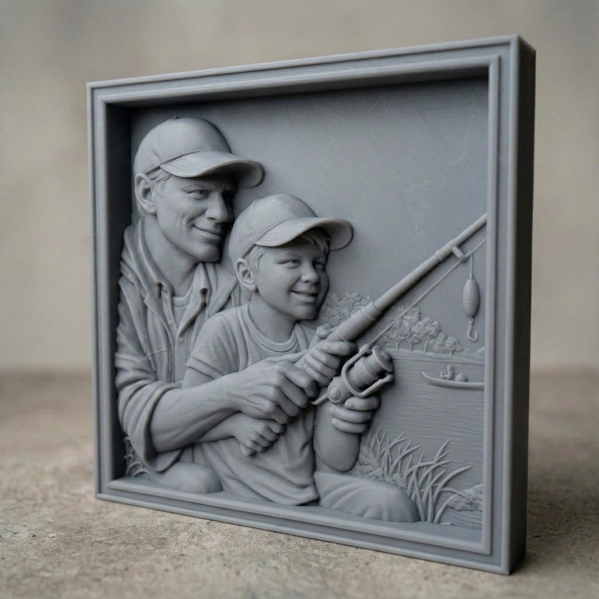 Bas relief carving of a father and young son sitting by a peaceful lake in spring, both wearing caps and smiling as they hold a fishing rod together. The father gently guides the child’s hands while casting toward calm water with a small boat in the distance. Framed square composition with detailed facial features, textured clothing, fresh grass, and serene springtime scenery, symbolizing bonding and outdoor family moments.