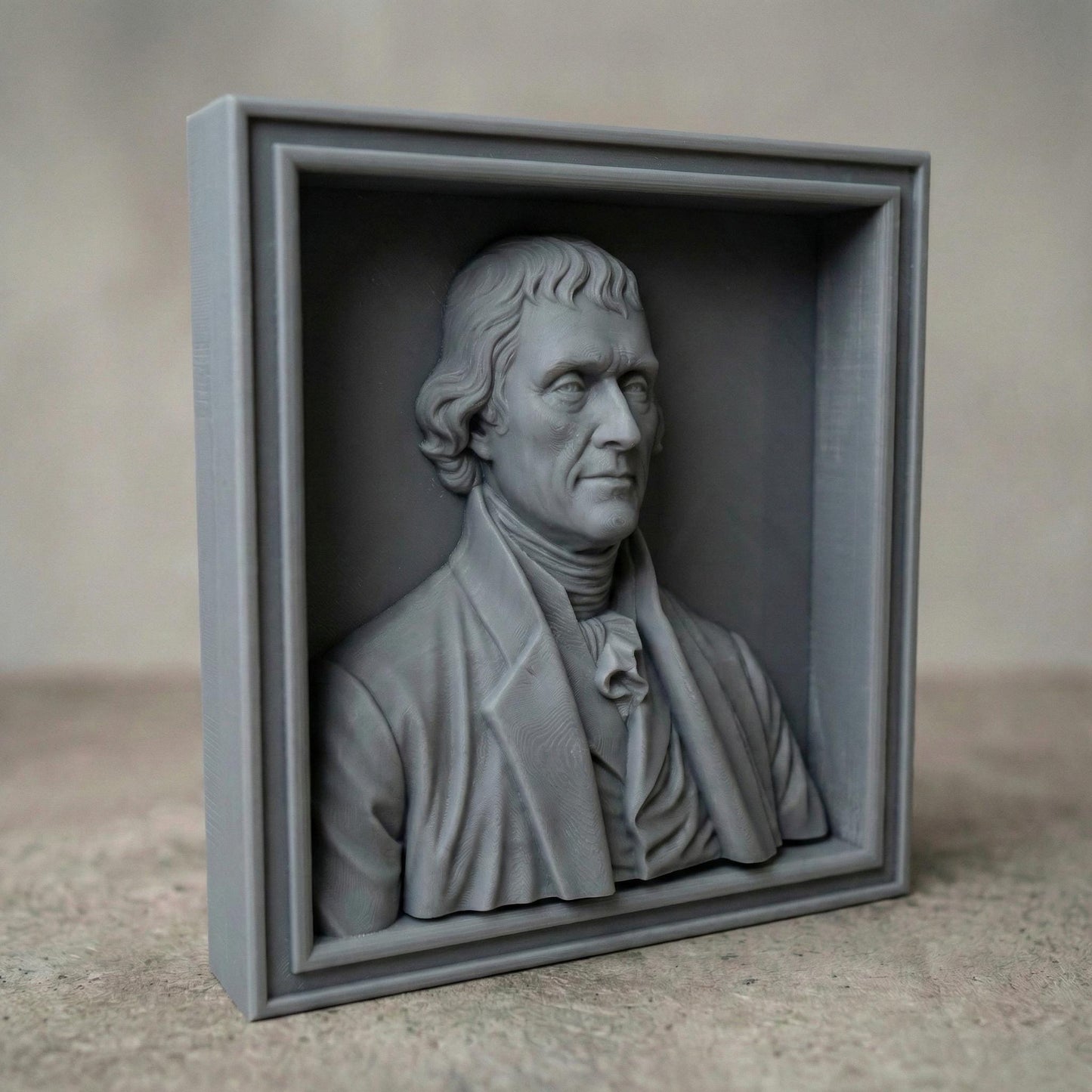 Highly detailed bas relief portrait of Thomas Jefferson carved in wood, framed in a classic square panel. The sculpture features refined facial contours, colonial-era clothing with cravat and coat, and natural wood grain texture enhancing depth and realism. Designed as a patriotic historical wall art piece ideal for CNC carving, 3D printing, and decorative relief projects.