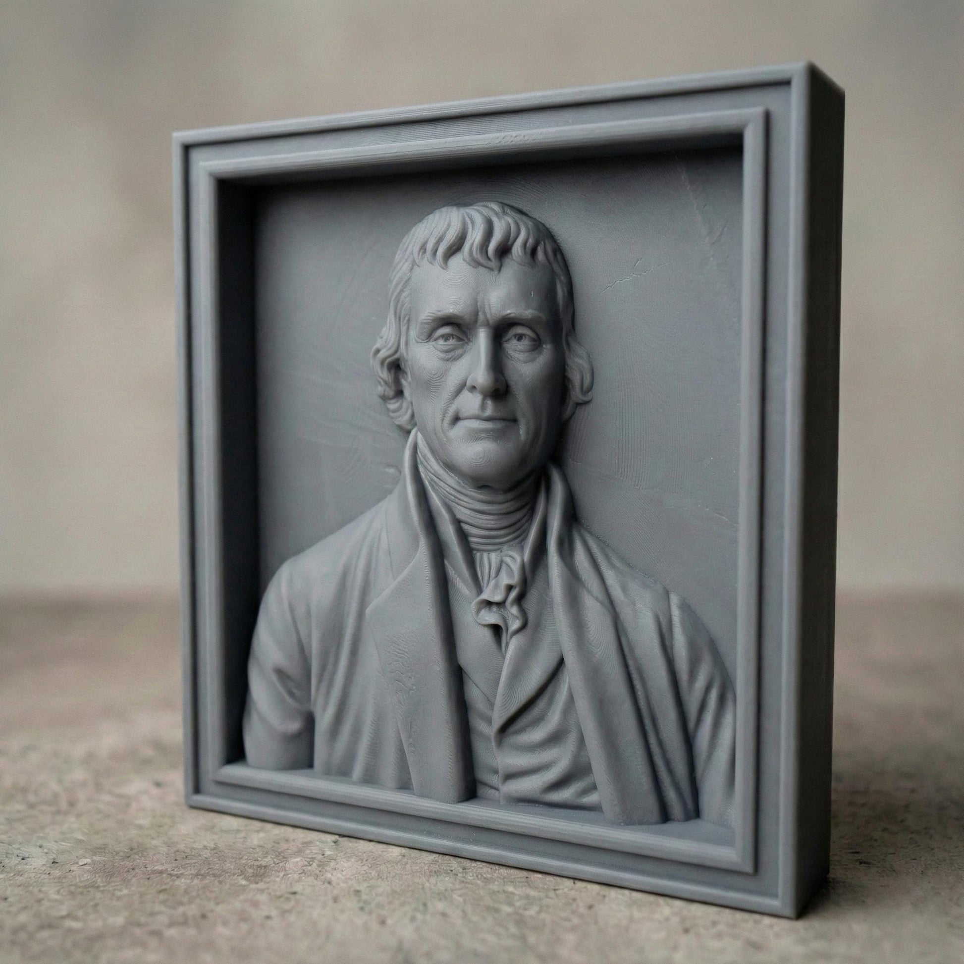 Highly detailed bas relief portrait of Thomas Jefferson carved in wood, framed in a classic square panel. The sculpture features refined facial contours, colonial-era clothing with cravat and coat, and natural wood grain texture enhancing depth and realism. Designed as a patriotic historical wall art piece ideal for CNC carving, 3D printing, and decorative relief projects.