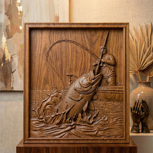 High-detail bas-relief carving of a fisherman standing in a boat, reeling in a massive jumping bass as water splashes dramatically around it. The scene features a bent fishing rod, textured fish scales, rippling waves, and dynamic motion captured in layered depth. Shown as both a rich wood-style carved panel and a smooth gray 3D print relief, framed as a striking rustic fishing lodge wall décor piece.