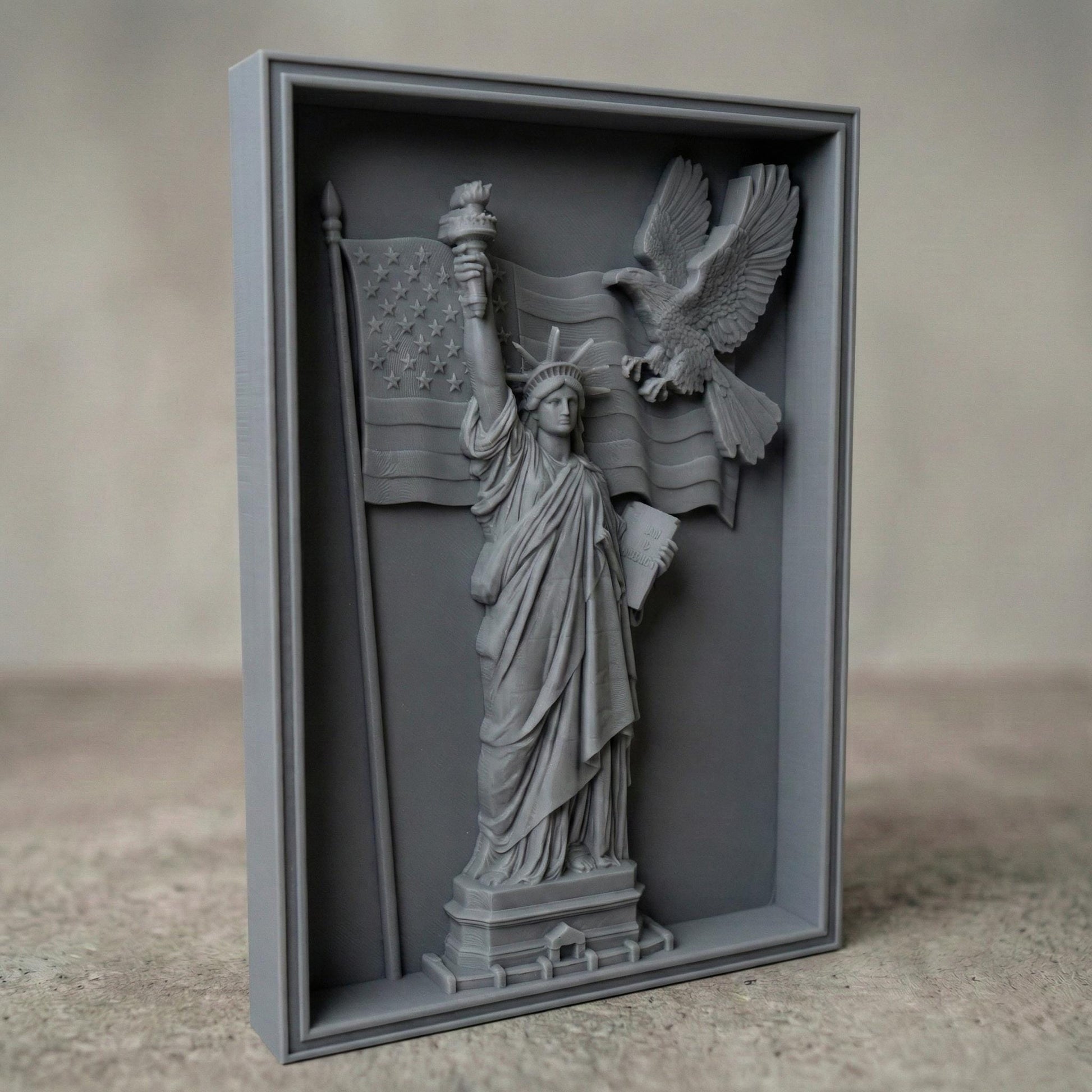 A detailed 3D bas-relief design featuring the Statue of Liberty holding a torch and a book, with a bald eagle soaring across a flowing American flag. This powerful vertical artwork celebrates Independence Day (United States) and is perfect for CNC carving, laser engraving, or 3D printing on wood, resin, or stone. Ideal for July 4th patriotic displays, American-themed home decor, and gifting. A striking tribute to freedom, liberty, and national pride.