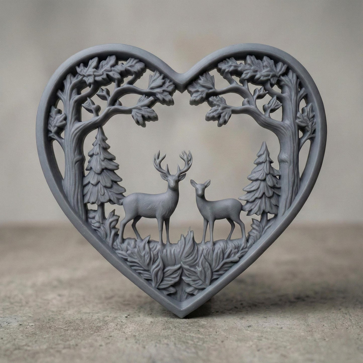 Heart-shaped woodland scene featuring a stag and doe standing together inside a forest frame of detailed oak trees and pine trees. The openwork design includes flowing branches and carved leaves surrounding the deer couple, symbolizing love, nature, family, and harmony. Designed as a decorative wall art panel for CNC carving and 3D printing with rich organic textures and rustic charm.
