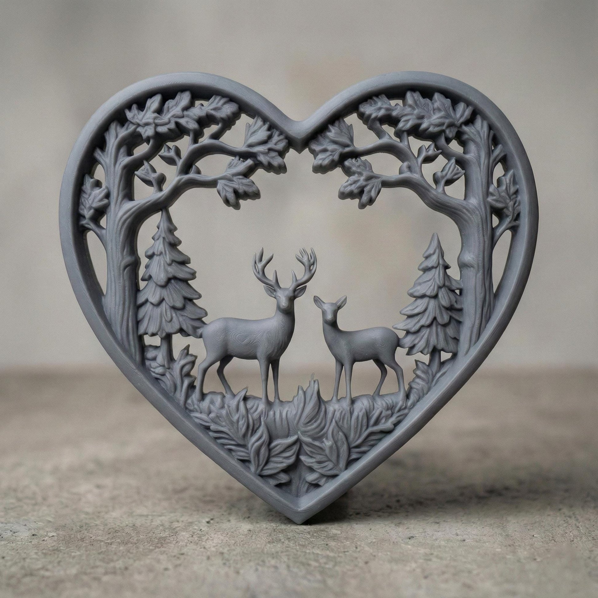 Heart-shaped woodland scene featuring a stag and doe standing together inside a forest frame of detailed oak trees and pine trees. The openwork design includes flowing branches and carved leaves surrounding the deer couple, symbolizing love, nature, family, and harmony. Designed as a decorative wall art panel for CNC carving and 3D printing with rich organic textures and rustic charm.