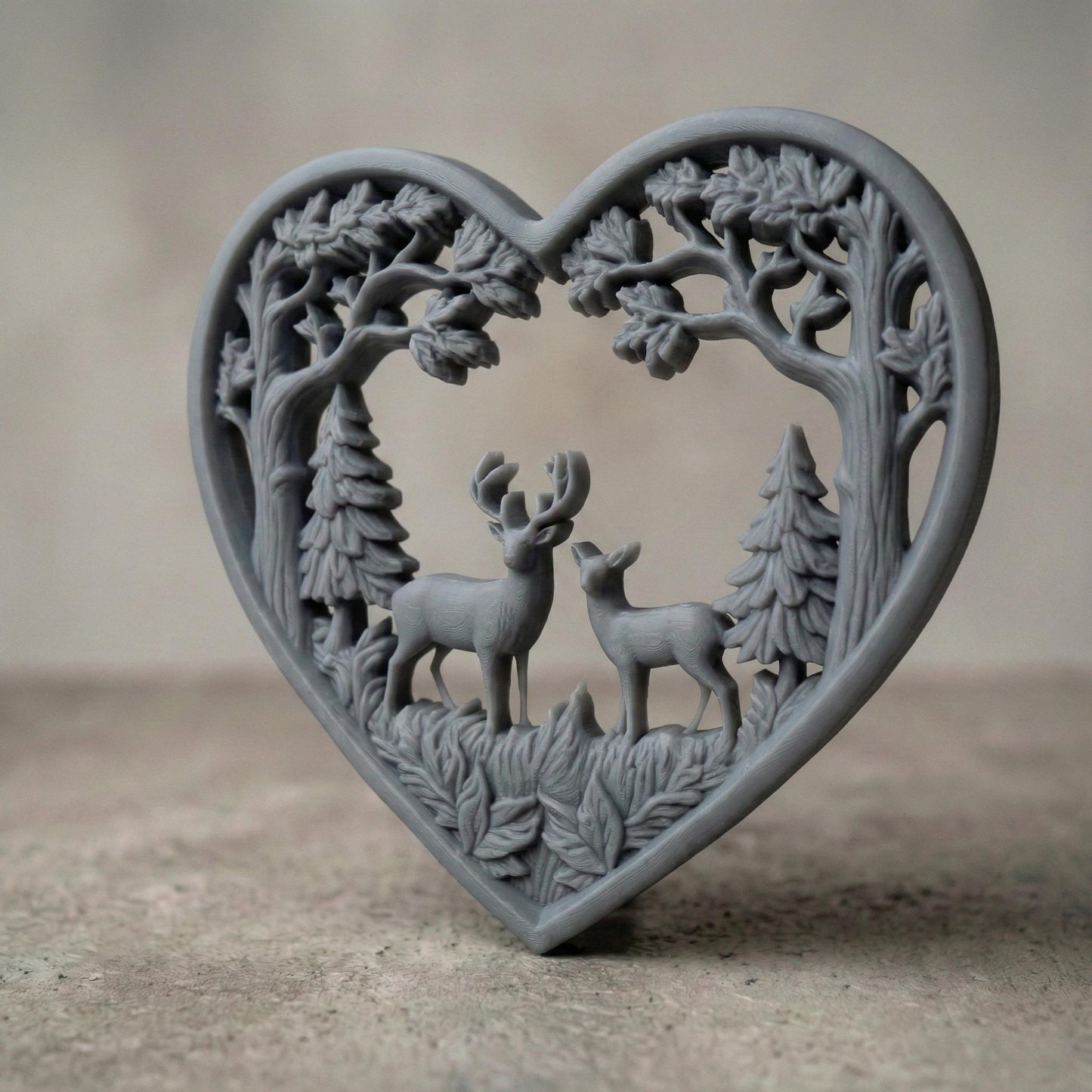 Heart-shaped woodland scene featuring a stag and doe standing together inside a forest frame of detailed oak trees and pine trees. The openwork design includes flowing branches and carved leaves surrounding the deer couple, symbolizing love, nature, family, and harmony. Designed as a decorative wall art panel for CNC carving and 3D printing with rich organic textures and rustic charm.