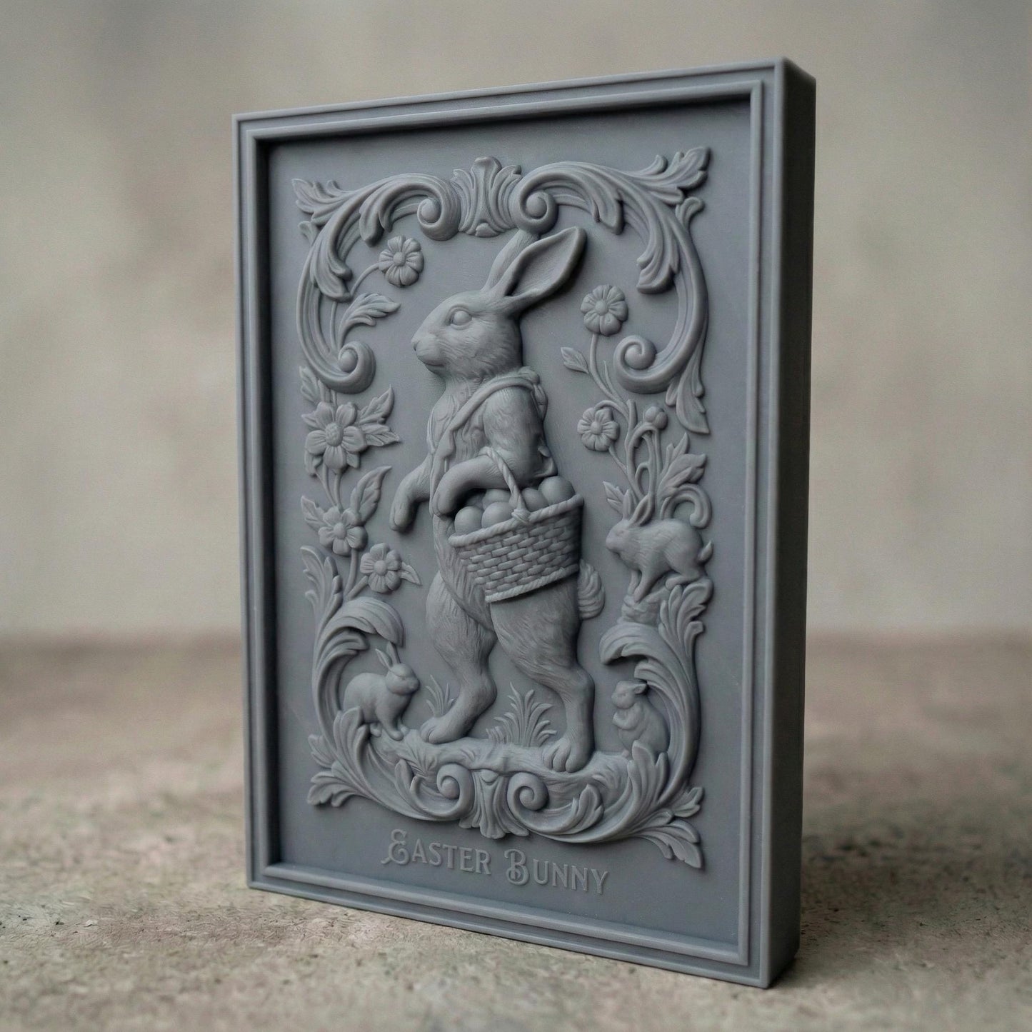 Decorative bas-relief panel featuring a standing Easter bunny holding a woven basket filled with eggs. The rabbit is surrounded by elegant floral scrollwork, blooming flowers, and small rabbits at the base. The framed vertical composition has a vintage ornamental style, designed for CNC carving or 3D printing as festive spring and Easter wall decor.