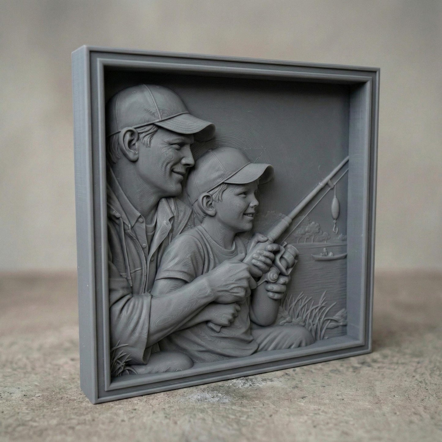 Bas relief carving of a father and young son sitting by a peaceful lake in spring, both wearing caps and smiling as they hold a fishing rod together. The father gently guides the child’s hands while casting toward calm water with a small boat in the distance. Framed square composition with detailed facial features, textured clothing, fresh grass, and serene springtime scenery, symbolizing bonding and outdoor family moments.