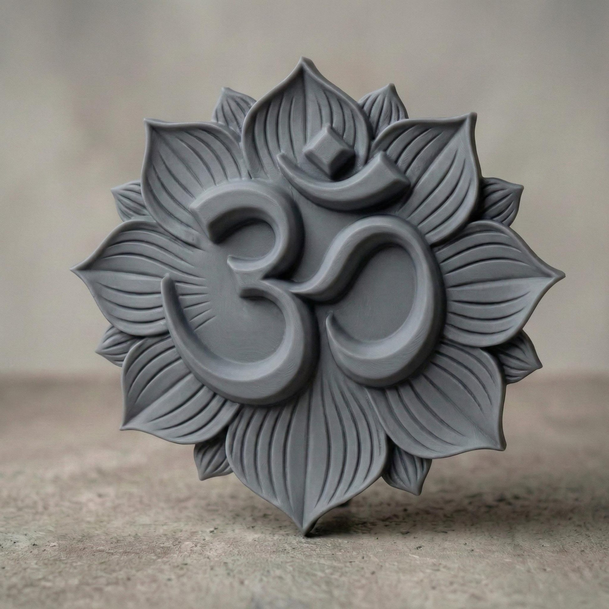 High-relief 3D Om symbol centered within a layered lotus flower mandala, featuring deep carved petals radiating outward in symmetrical harmony. The design shows smooth, flowing curves of the sacred Om sign raised above textured lotus leaves, ideal for CNC carving, bas-relief wall panels, spiritual décor, yoga studio art, and meditation room focal pieces. Intricate petal detailing enhances depth, shadow, and dimensional elegance.