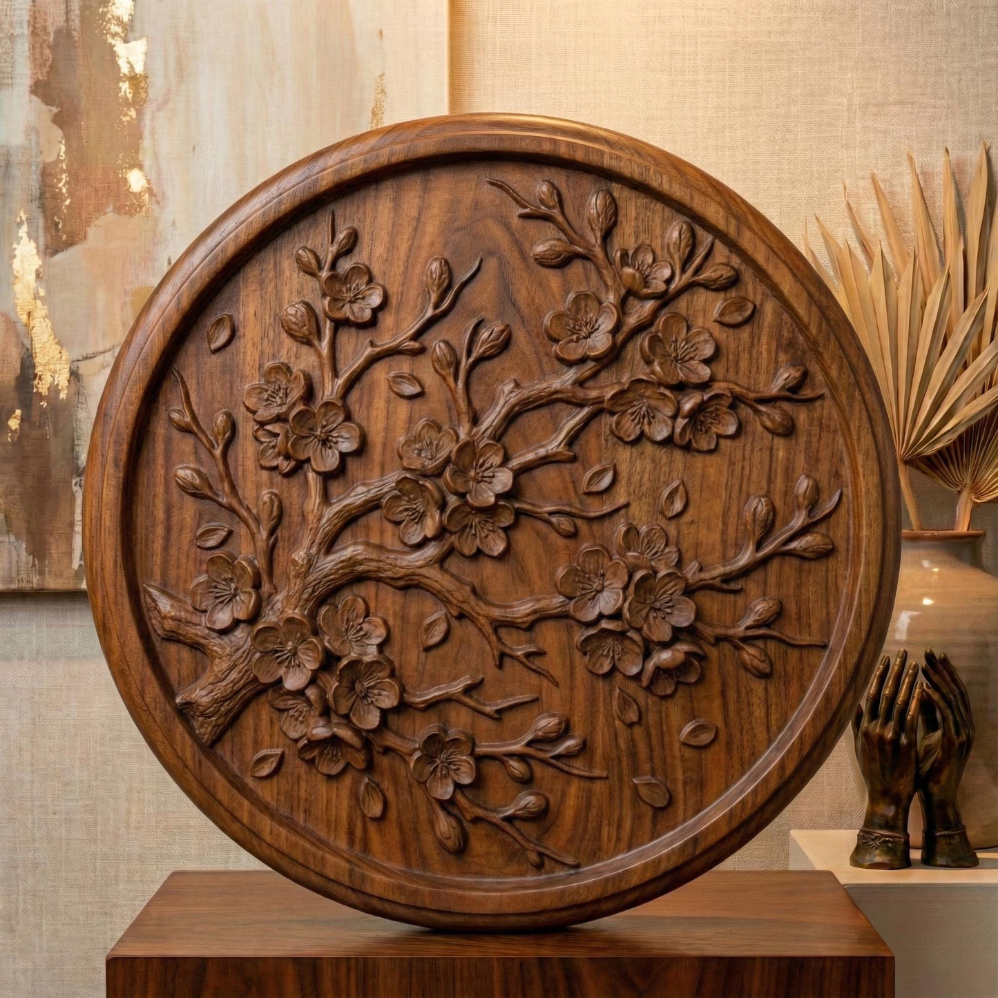 Circular bas-relief panel featuring an elegant cherry blossom branch in full bloom, with layered petals, delicate buds, and gently scattered leaves. The flowing branch curves organically across a textured woodgrain background, framed by a smooth round border. Deep carving creates soft shadows and dimensional detail, ideal for CNC carving, 3D printing, spring décor, and botanical wall art projects.
