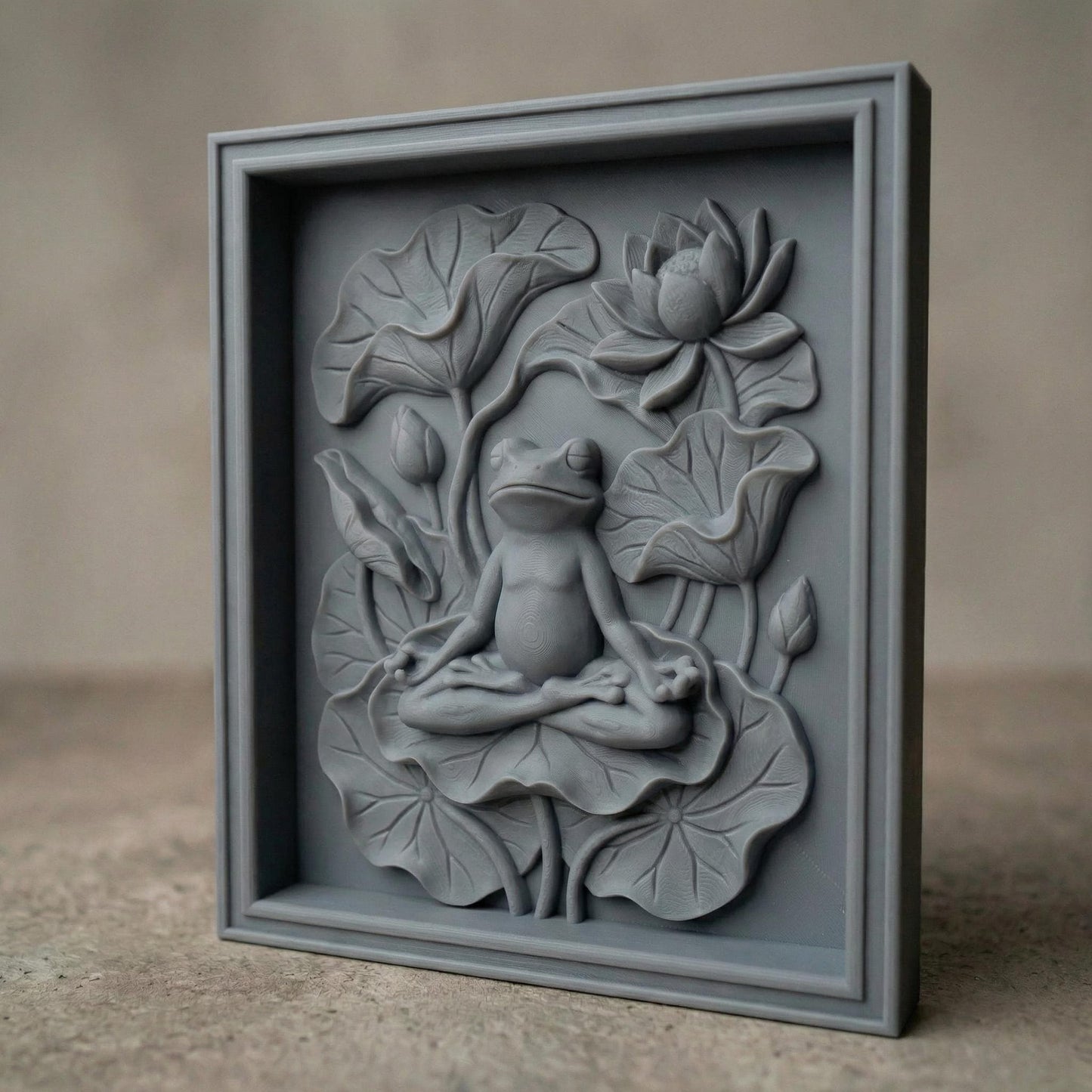 High-relief bas-relief panel featuring a peaceful frog seated in meditation pose atop layered lotus leaves, surrounded by blooming lotus flower and curved botanical stems. The composition symbolizes spring renewal, balance, and harmony in nature. Deep carved contours and textured foliage create strong dimensional shadows, ideal for CNC carving, 3D printing, and tranquil Zen-inspired seasonal wall décor.