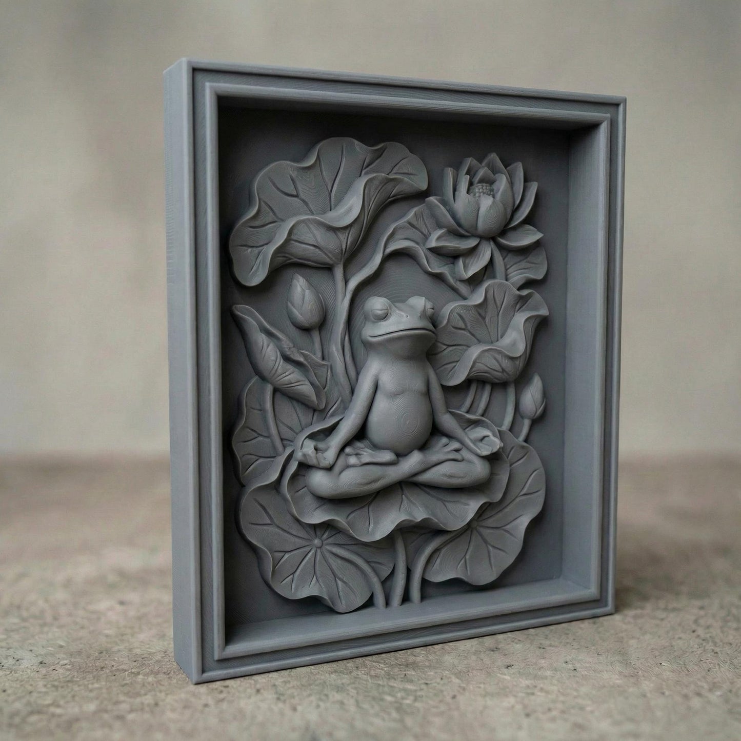 High-relief bas-relief panel featuring a peaceful frog seated in meditation pose atop layered lotus leaves, surrounded by blooming lotus flower and curved botanical stems. The composition symbolizes spring renewal, balance, and harmony in nature. Deep carved contours and textured foliage create strong dimensional shadows, ideal for CNC carving, 3D printing, and tranquil Zen-inspired seasonal wall décor.