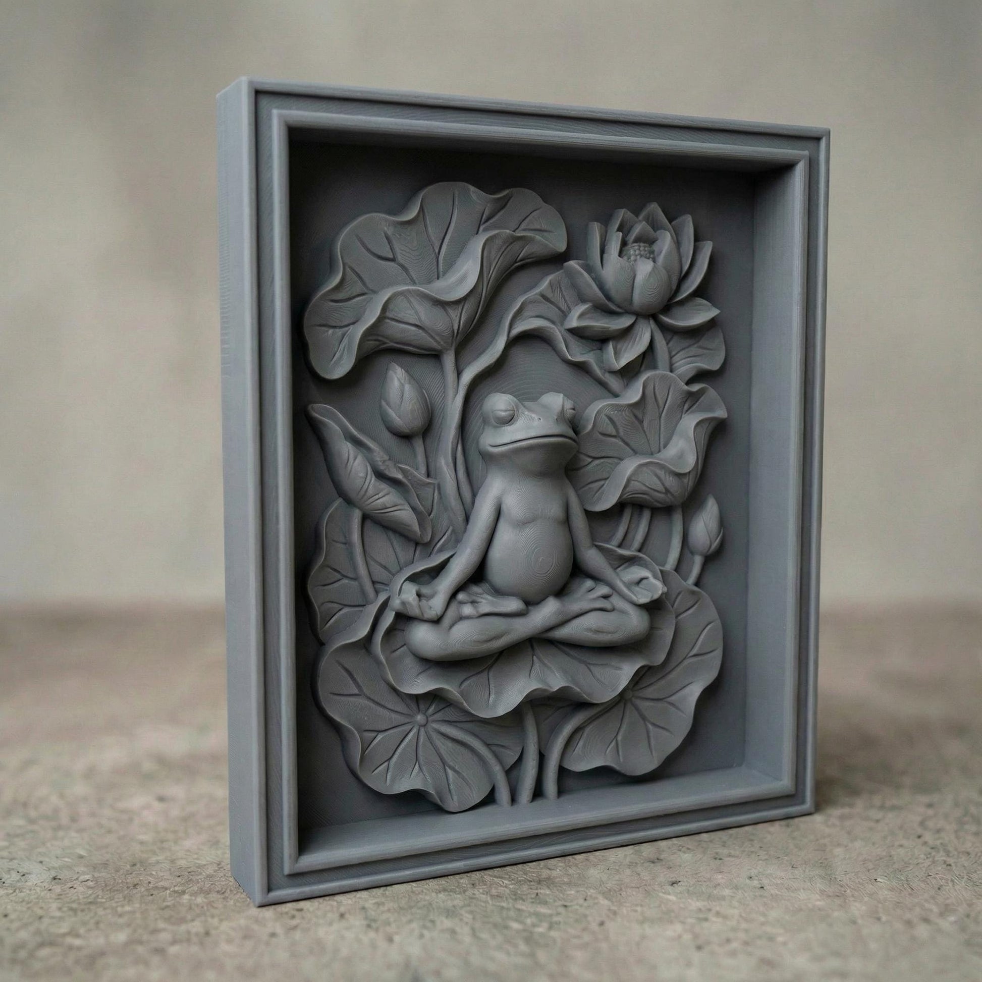 High-relief bas-relief panel featuring a peaceful frog seated in meditation pose atop layered lotus leaves, surrounded by blooming lotus flower and curved botanical stems. The composition symbolizes spring renewal, balance, and harmony in nature. Deep carved contours and textured foliage create strong dimensional shadows, ideal for CNC carving, 3D printing, and tranquil Zen-inspired seasonal wall décor.
