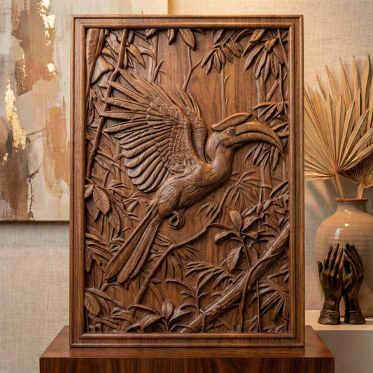 Highly detailed bas-relief carving of a hornbill bird with wide spread wings perched among dense tropical leaves and branches. The bird’s long curved beak and layered feathers are sculpted in deep relief, surrounded by jungle foliage that creates a rich wildlife scene suitable for CNC carving, 3D printing, or decorative wall art.