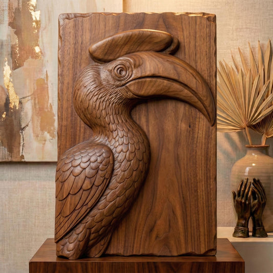 Detailed bas-relief carving of a hornbill bird head with a large curved beak and distinctive casque, sculpted with layered feathers and smooth contours. The tropical wildlife design is carved on a natural wood slab style background with organic edges, creating elegant jungle-inspired spring and summer wall art suitable for CNC carving or 3D printing.