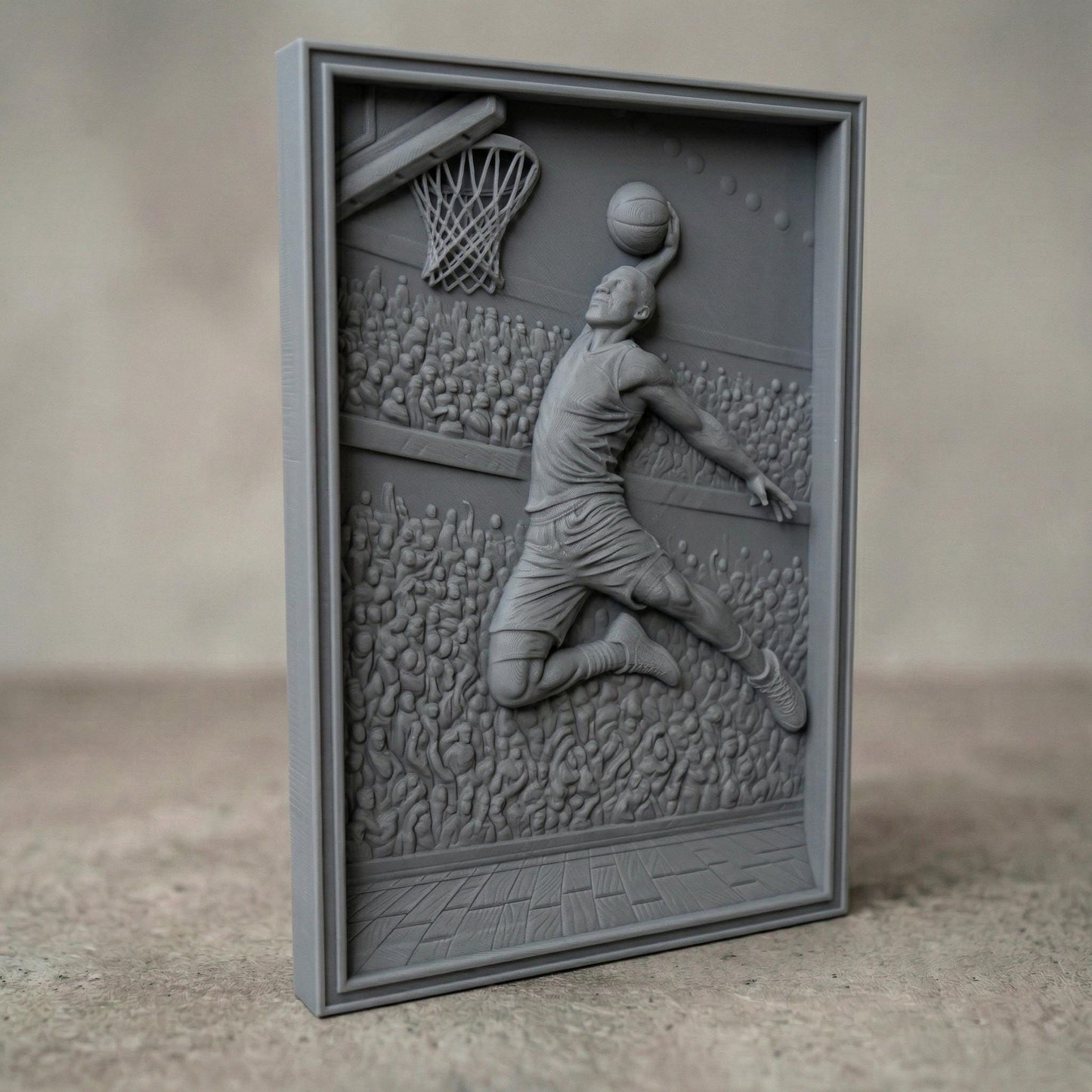 Dynamic bas-relief carving of a basketball player soaring mid-air for a powerful dunk, surrounded by a packed arena crowd, detailed court flooring, and hoop with net, capturing motion, athletic energy, and depth in a bold sports-themed composition.