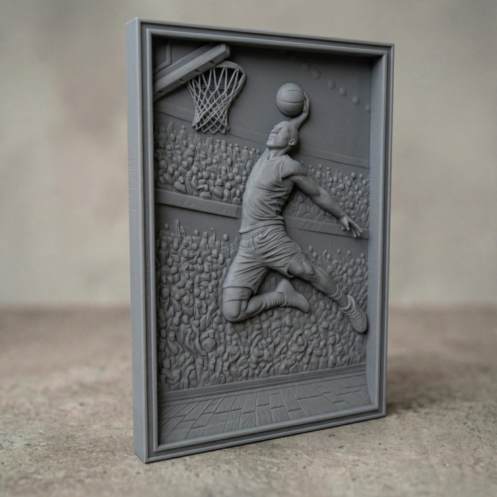 Dynamic bas-relief carving of a basketball player soaring mid-air for a powerful dunk, surrounded by a packed arena crowd, detailed court flooring, and hoop with net, capturing motion, athletic energy, and depth in a bold sports-themed composition.
