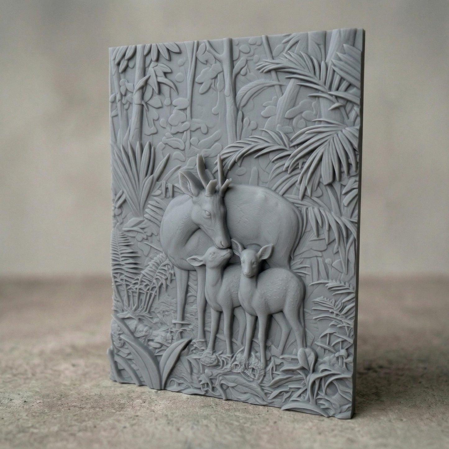 Intricate bas-relief carving of a deer family with a stag and two fawns standing closely together in a lush forest, surrounded by dense foliage, leaves, and natural woodland textures, capturing warmth, protection, and harmony in a detailed nature composition.