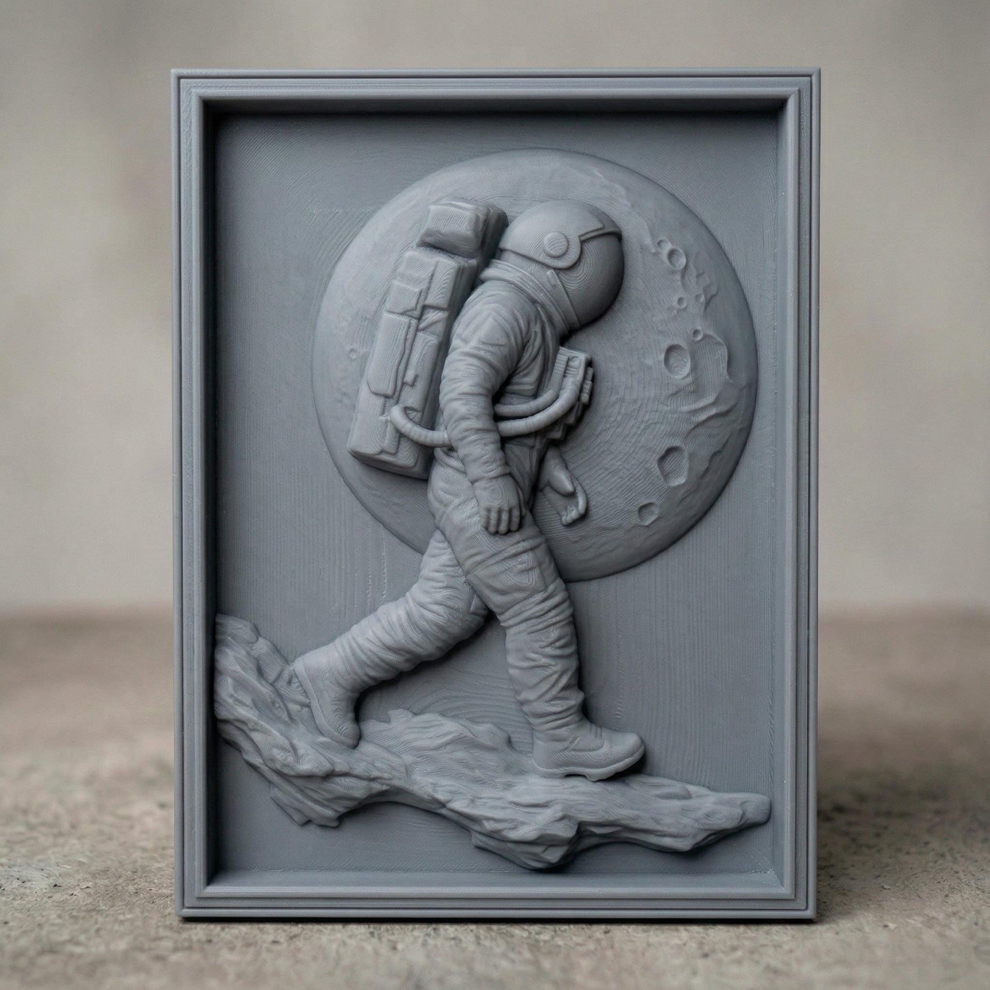 Detailed bas-relief carving of an astronaut walking across a rocky lunar surface with a large cratered moon behind. The figure wears a full space suit with backpack and helmet, captured mid-step in a futuristic exploration scene. Rich wood grain texture and depth create a bold, adventurous composition symbolizing discovery and space travel.