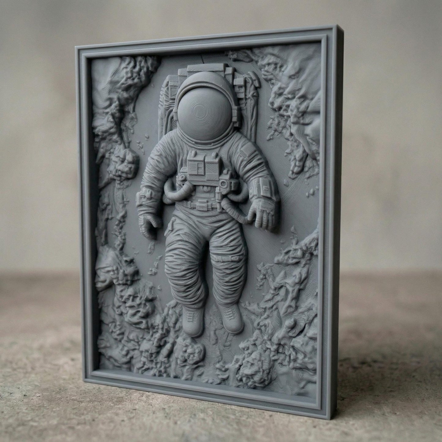 Intricate bas-relief carving of an astronaut floating weightlessly in space, surrounded by textured cosmic rock formations and abstract celestial terrain. The detailed suit, helmet, and tubing contrast with the organic, flowing background, while rich wood grain enhances depth and movement, evoking isolation, exploration, and the vast mystery of the universe.