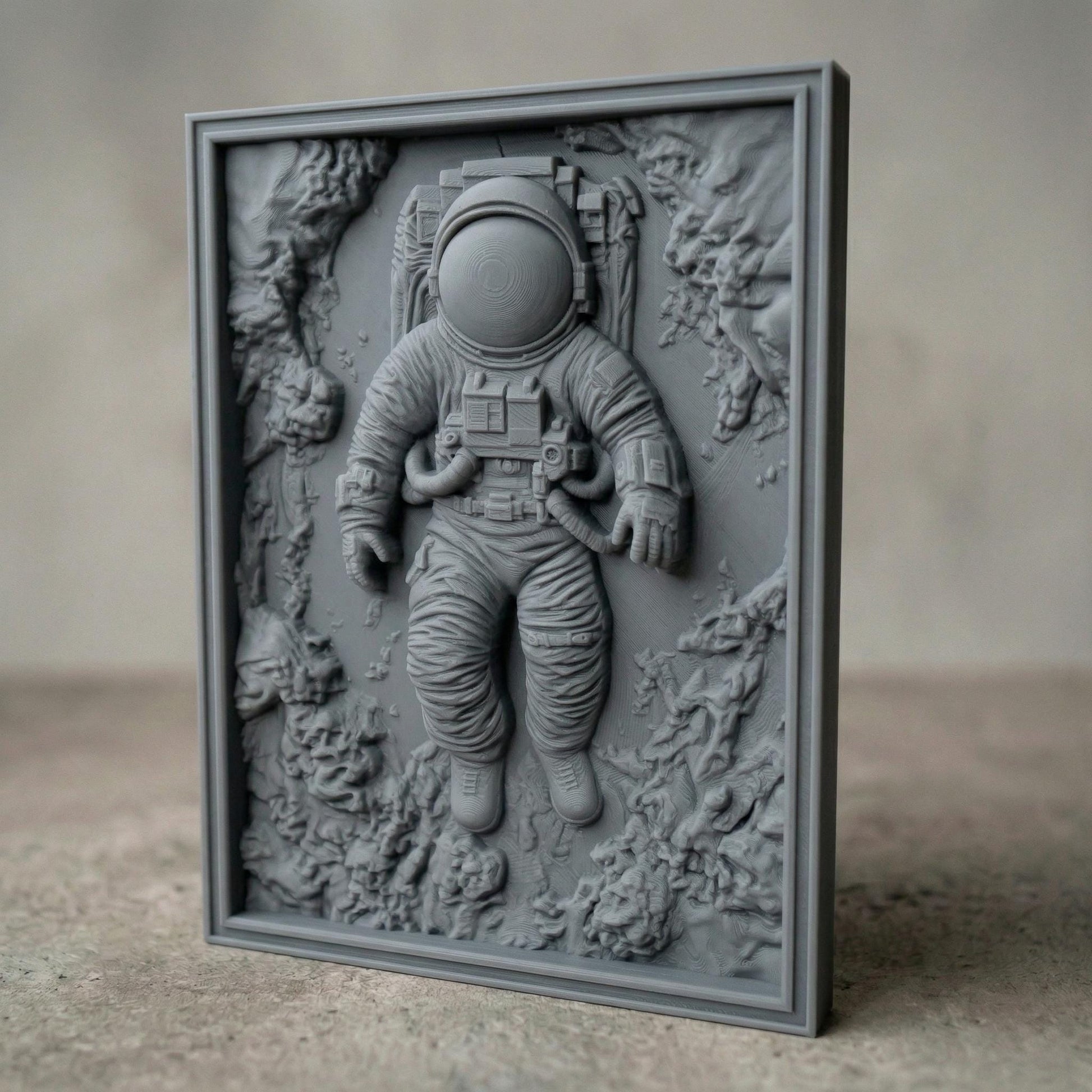 Intricate bas-relief carving of an astronaut floating weightlessly in space, surrounded by textured cosmic rock formations and abstract celestial terrain. The detailed suit, helmet, and tubing contrast with the organic, flowing background, while rich wood grain enhances depth and movement, evoking isolation, exploration, and the vast mystery of the universe.