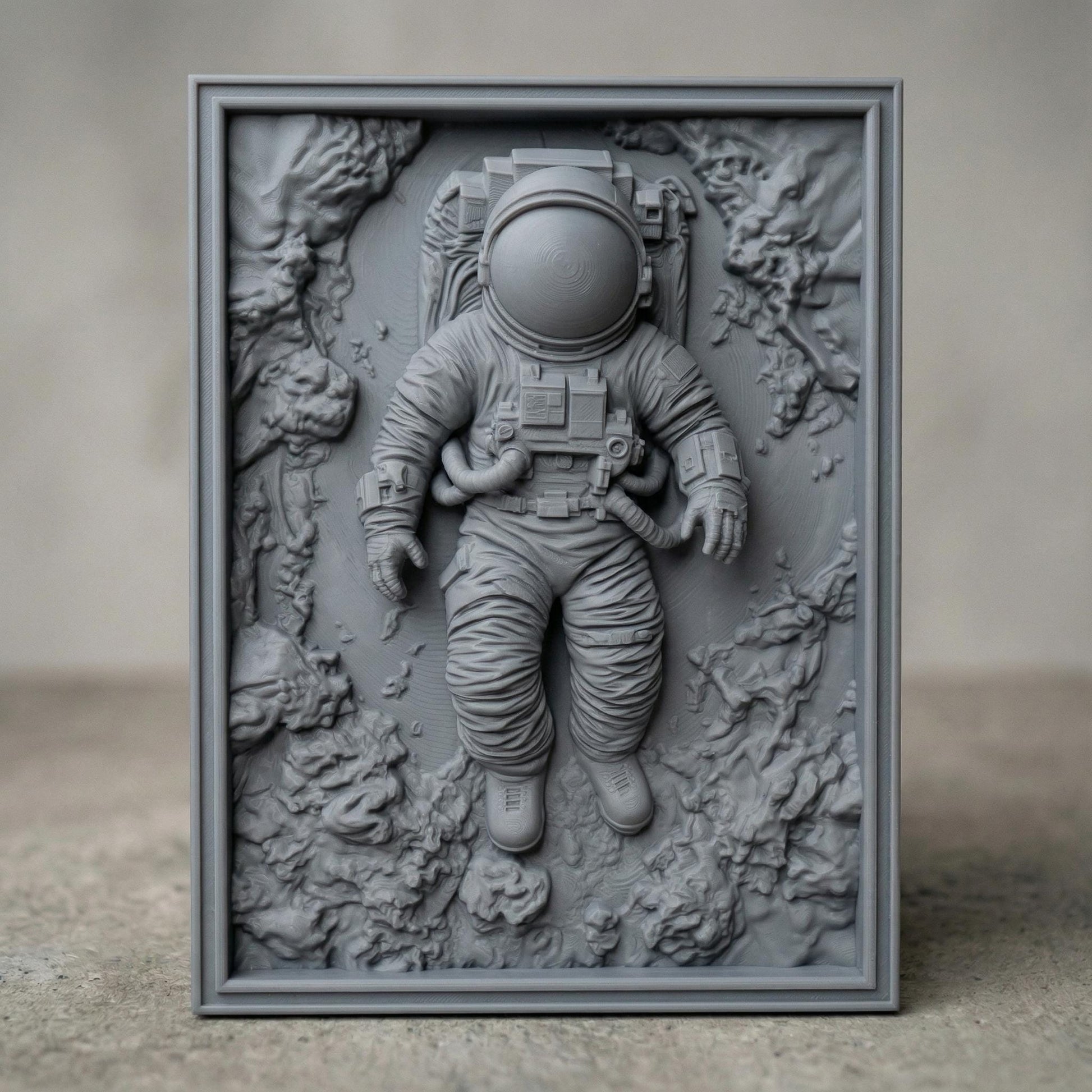 Intricate bas-relief carving of an astronaut floating weightlessly in space, surrounded by textured cosmic rock formations and abstract celestial terrain. The detailed suit, helmet, and tubing contrast with the organic, flowing background, while rich wood grain enhances depth and movement, evoking isolation, exploration, and the vast mystery of the universe.