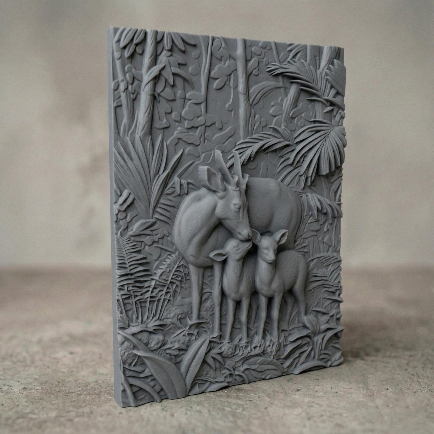 Intricate bas-relief carving of a deer family with a stag and two fawns standing closely together in a lush forest, surrounded by dense foliage, leaves, and natural woodland textures, capturing warmth, protection, and harmony in a detailed nature composition.
