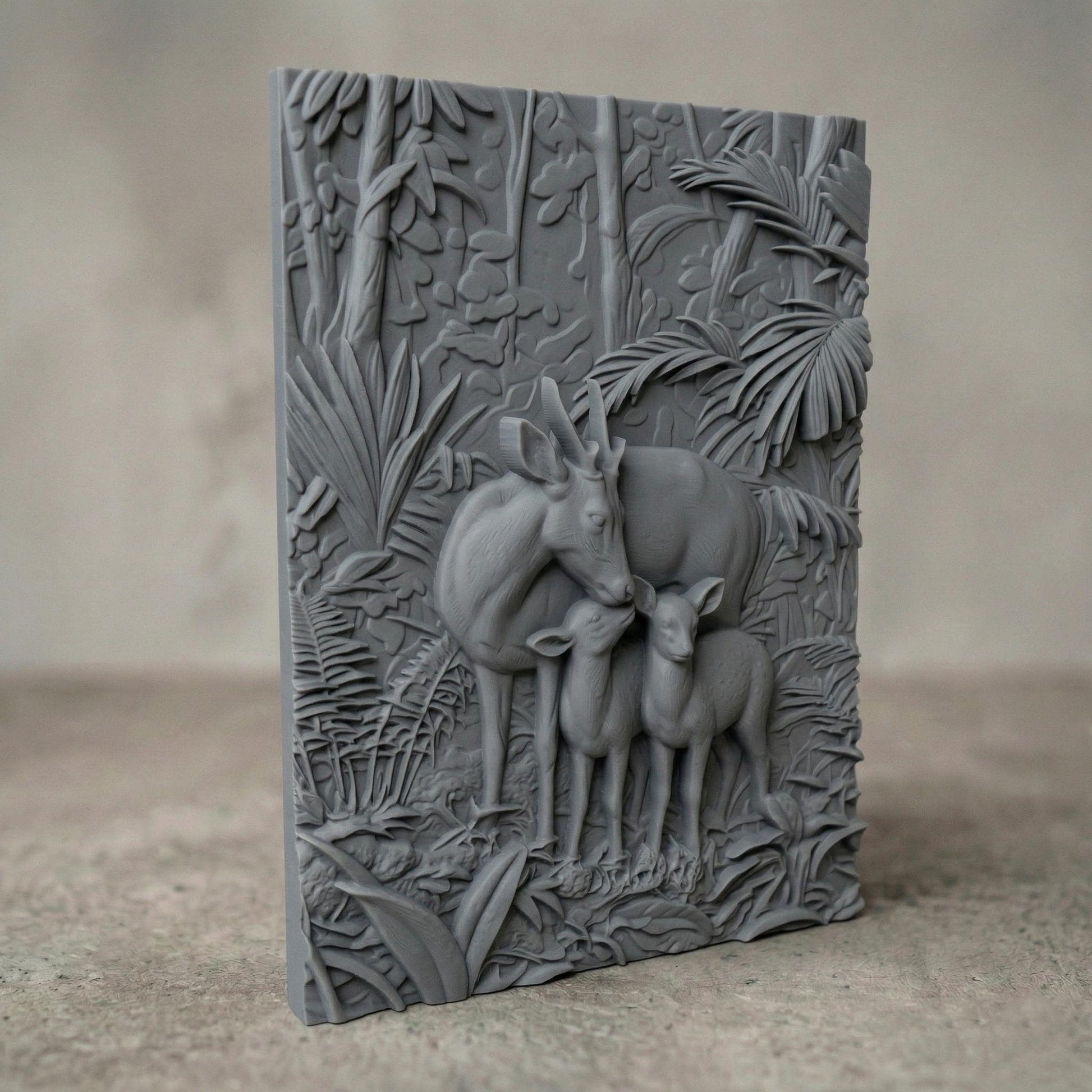 Intricate bas-relief carving of a deer family with a stag and two fawns standing closely together in a lush forest, surrounded by dense foliage, leaves, and natural woodland textures, capturing warmth, protection, and harmony in a detailed nature composition.